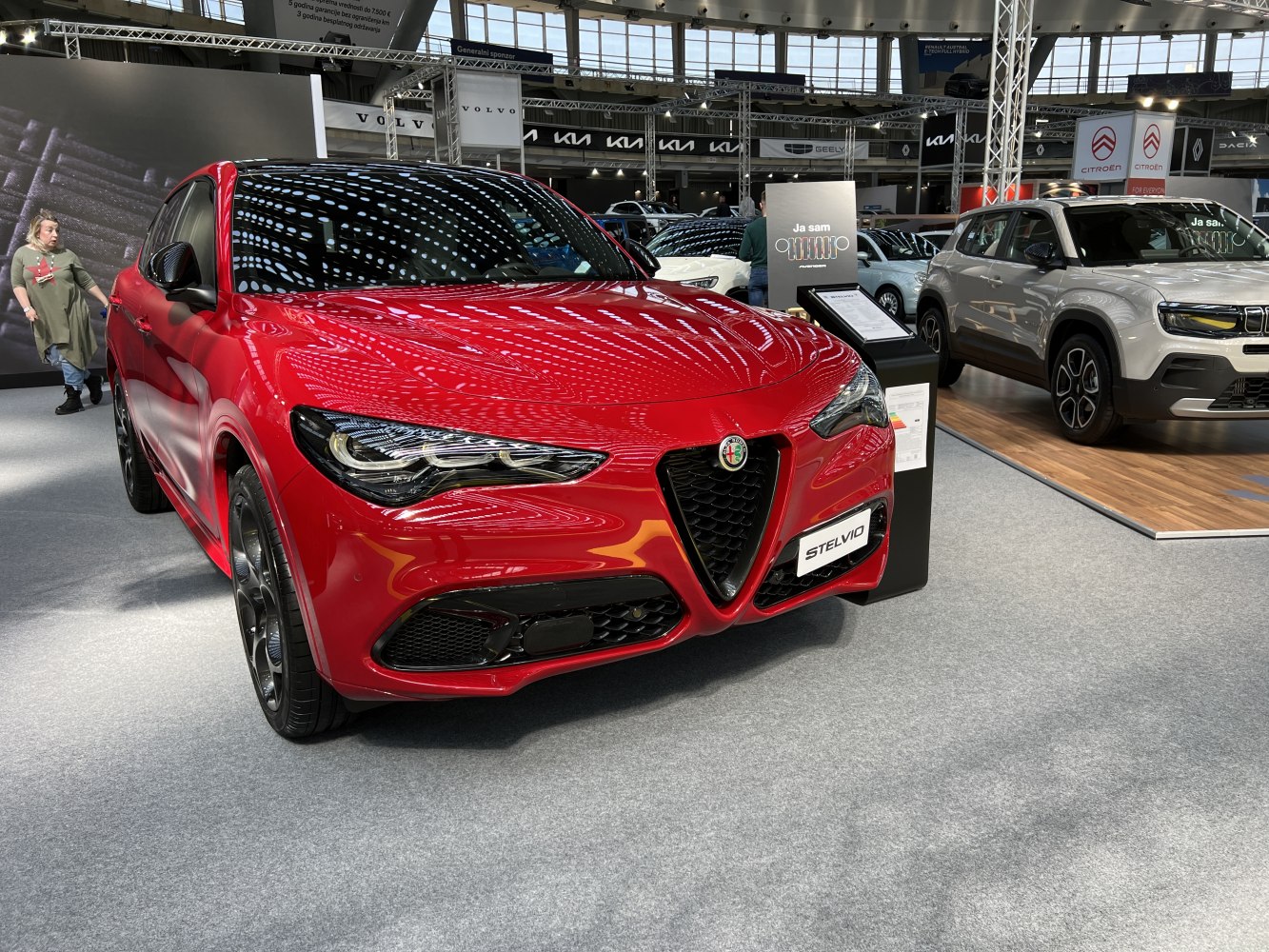 Red luxury SUV front with LED headlights and signature grille