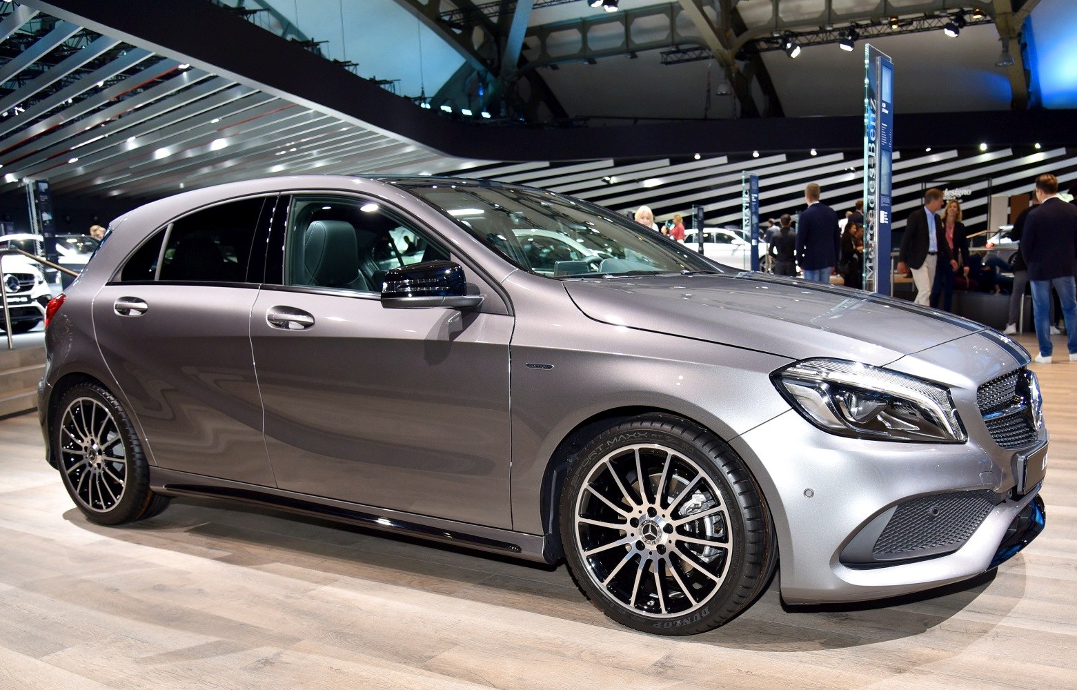Front side view of a silver hatchback with alloy wheels