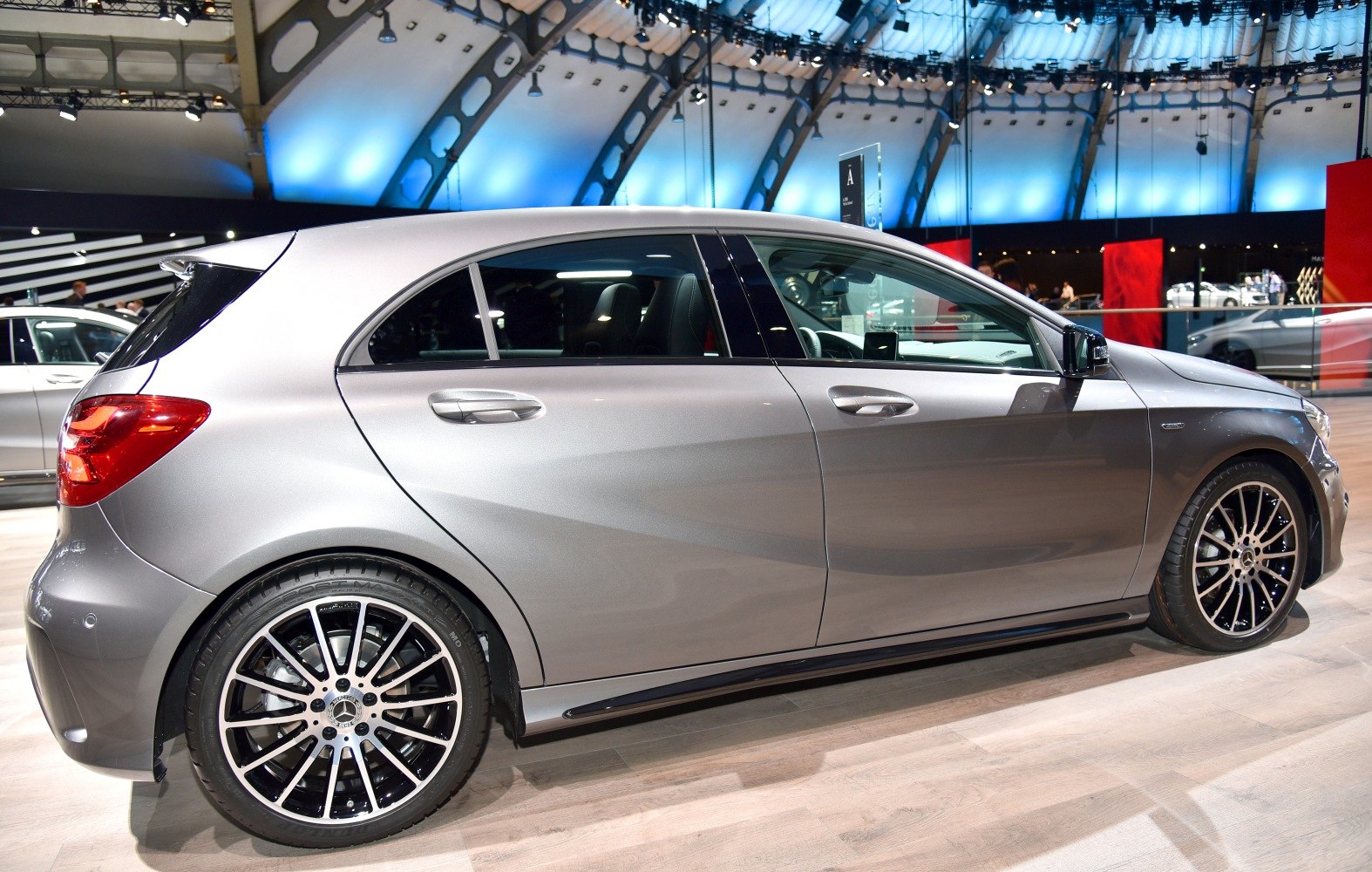 Side profile of hatchback with distinctive alloy wheels and modern design.