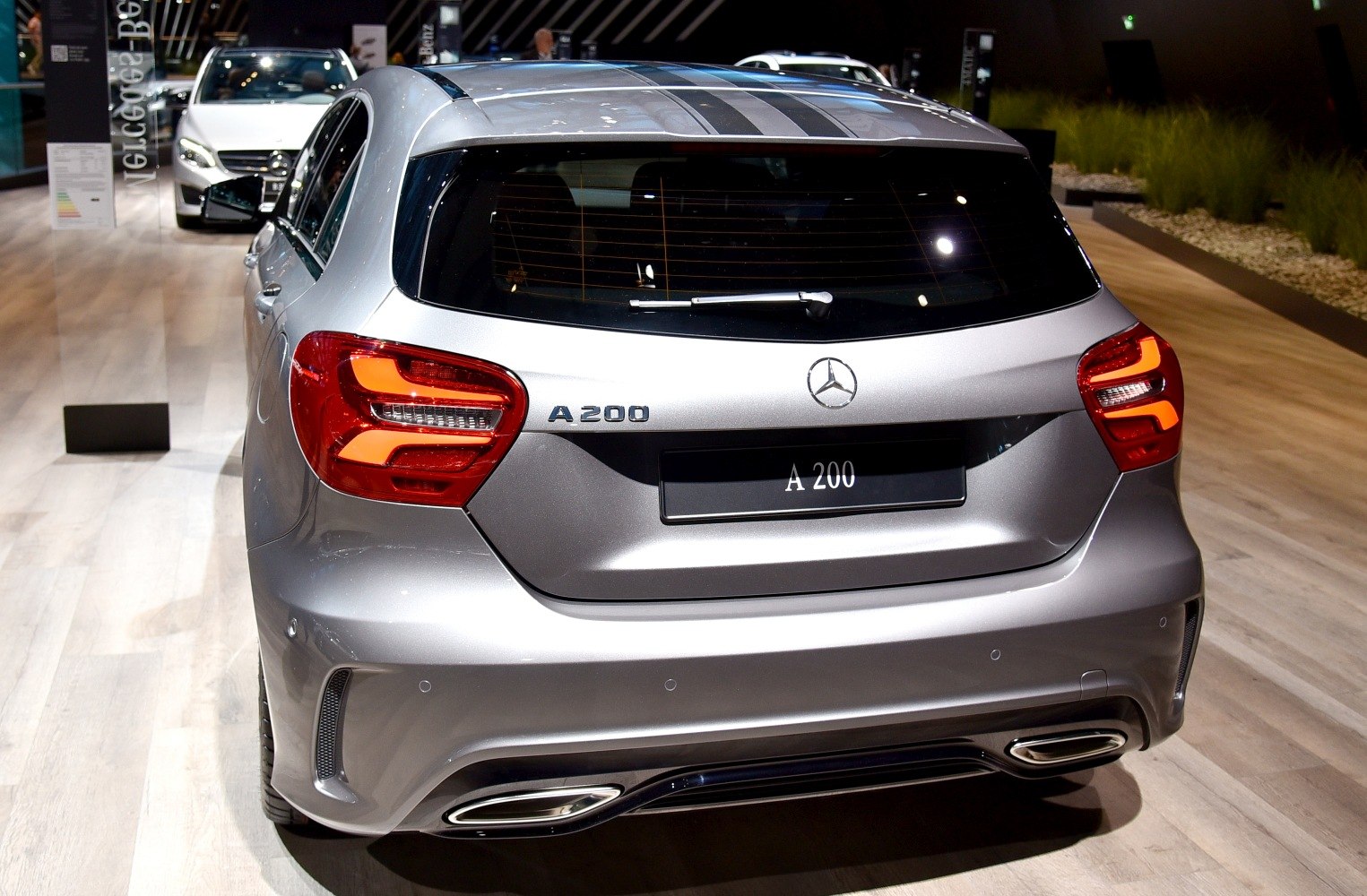 Rear hatchback section with unique tail lights, dual exhaust tips, and rear window wiper.