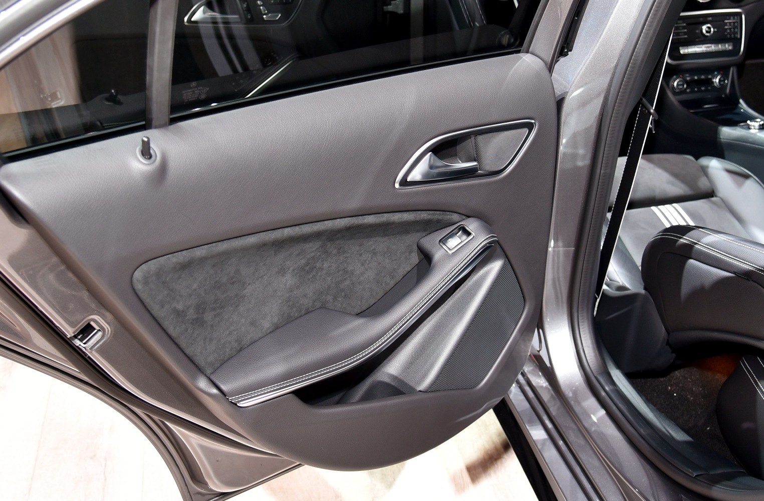 Rear door interior panel with armrest and window switch