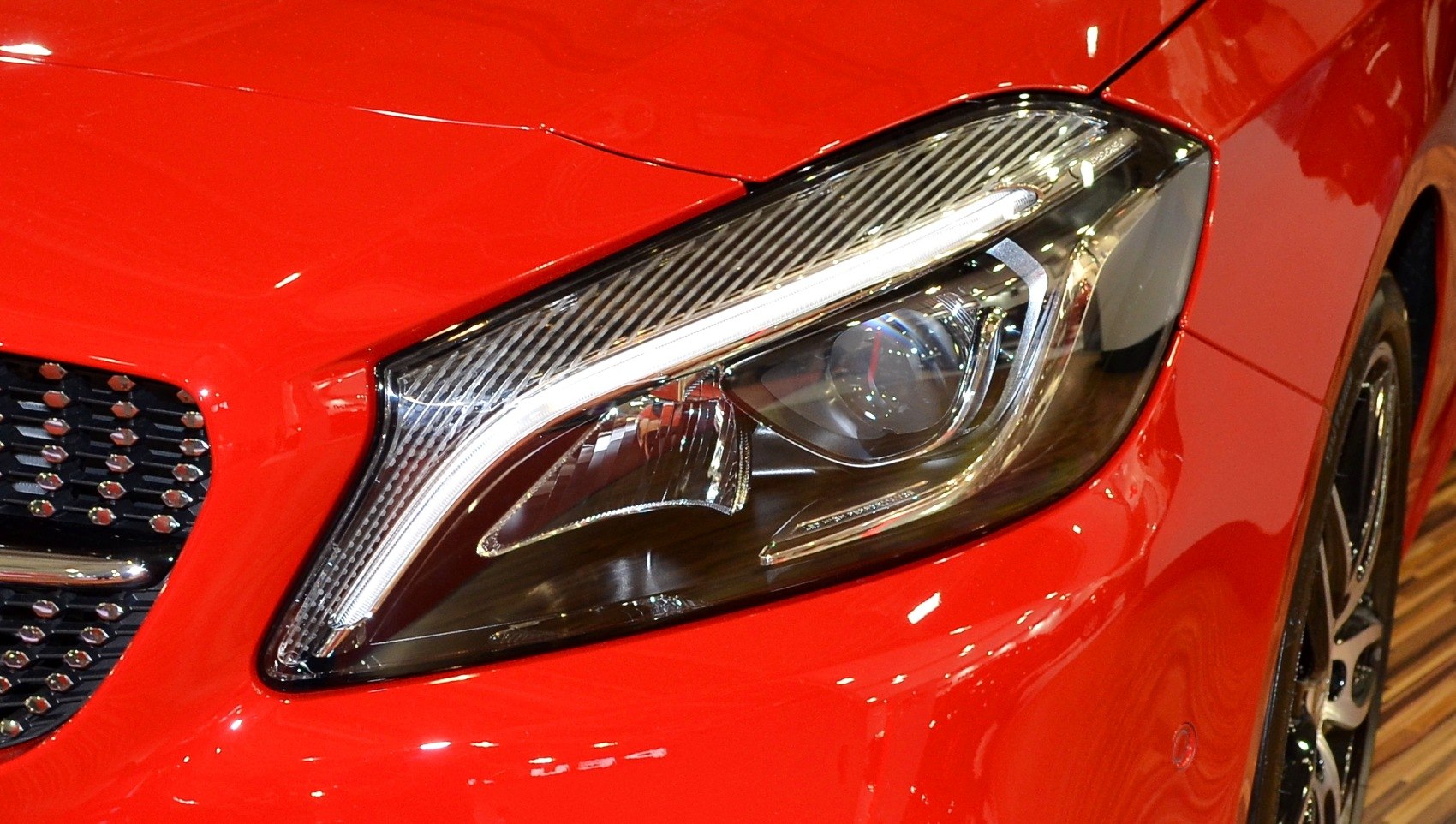 Close-up of modern headlight and grille detail