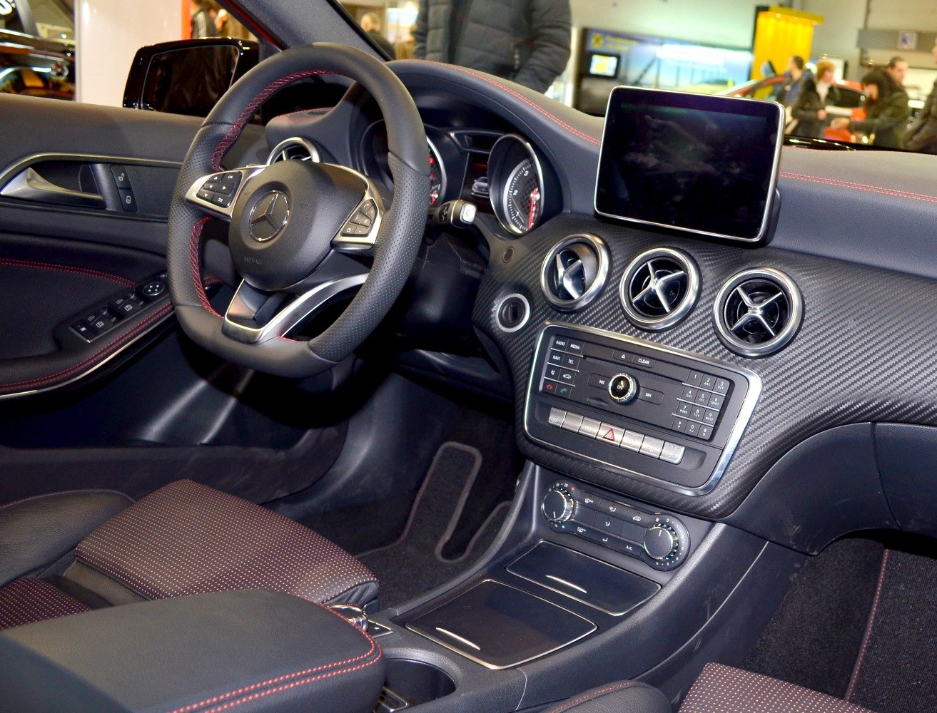 Modern dashboard with circular air vents and infotainment screen