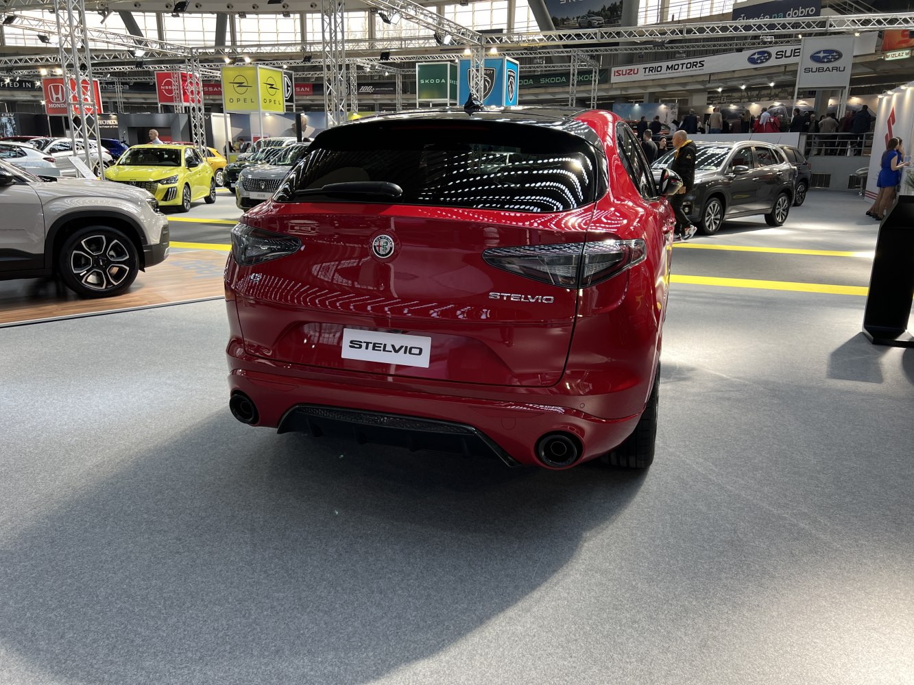 Rear view of Alfa Romeo Stelvio 949 with signature taillights and dual exhaust