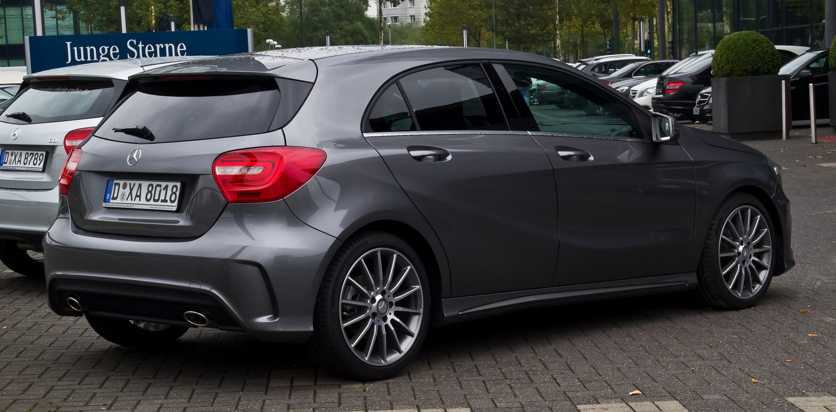 Rear and side view of a hatchback with sporty alloy wheels and distinctive taillights