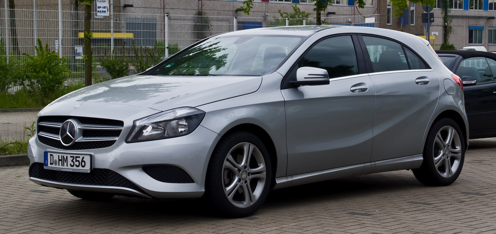 Silver hatchback with front side view showing design and wheels