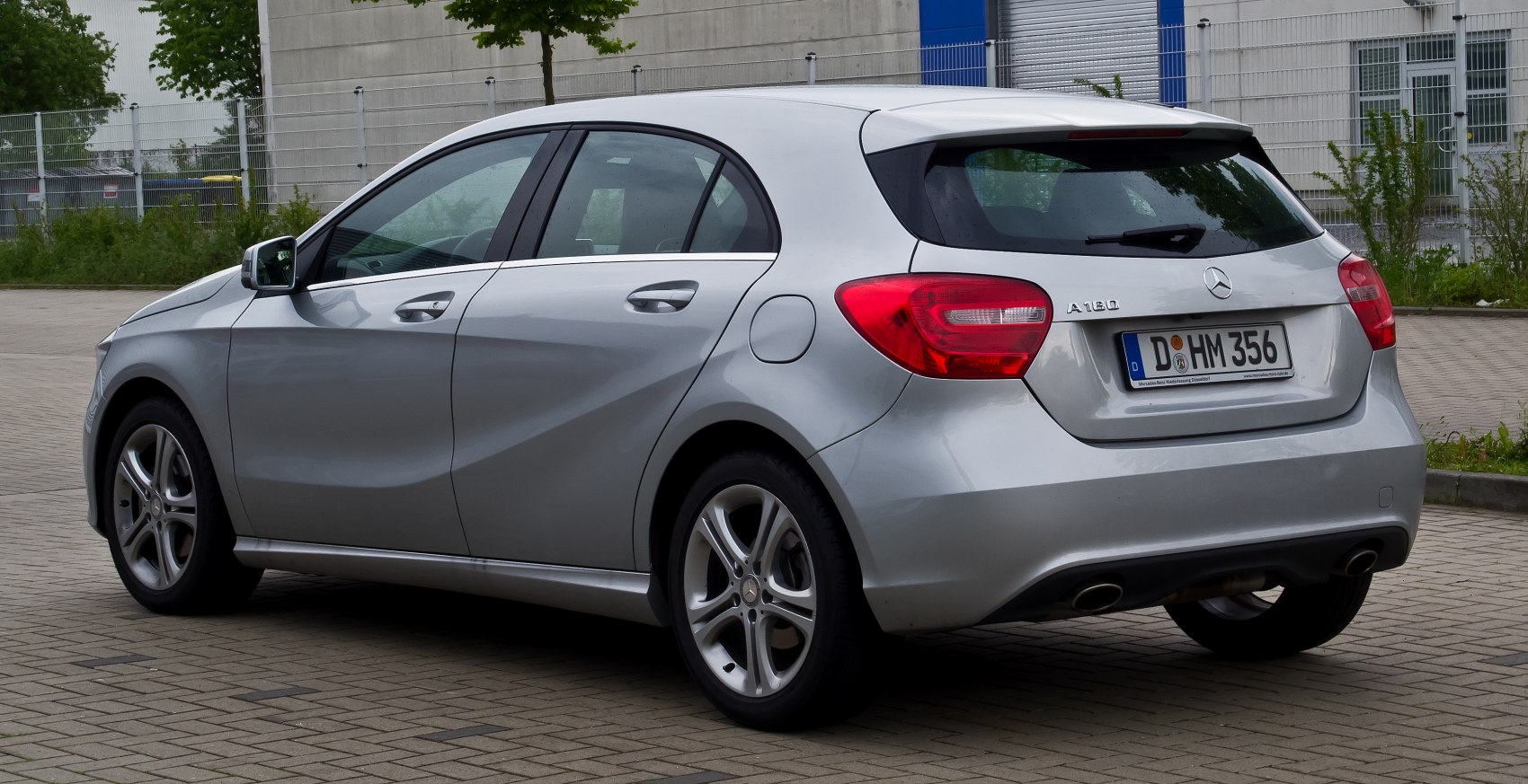 Rear view of hatchback with distinctive taillights and dual exhaust pipes