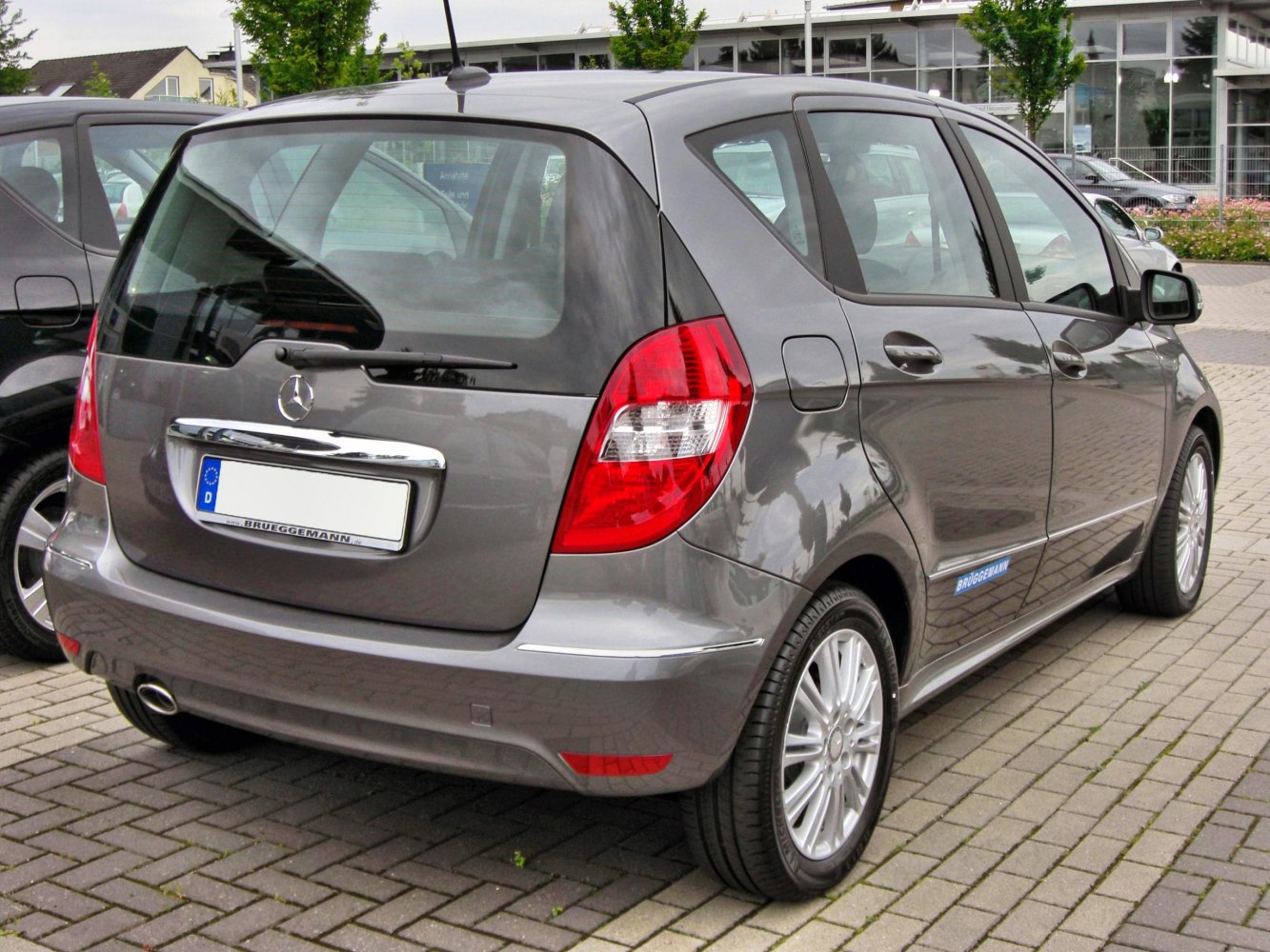 Rear view of a facelift compact hatchback with distinctive taillights and alloy wheels