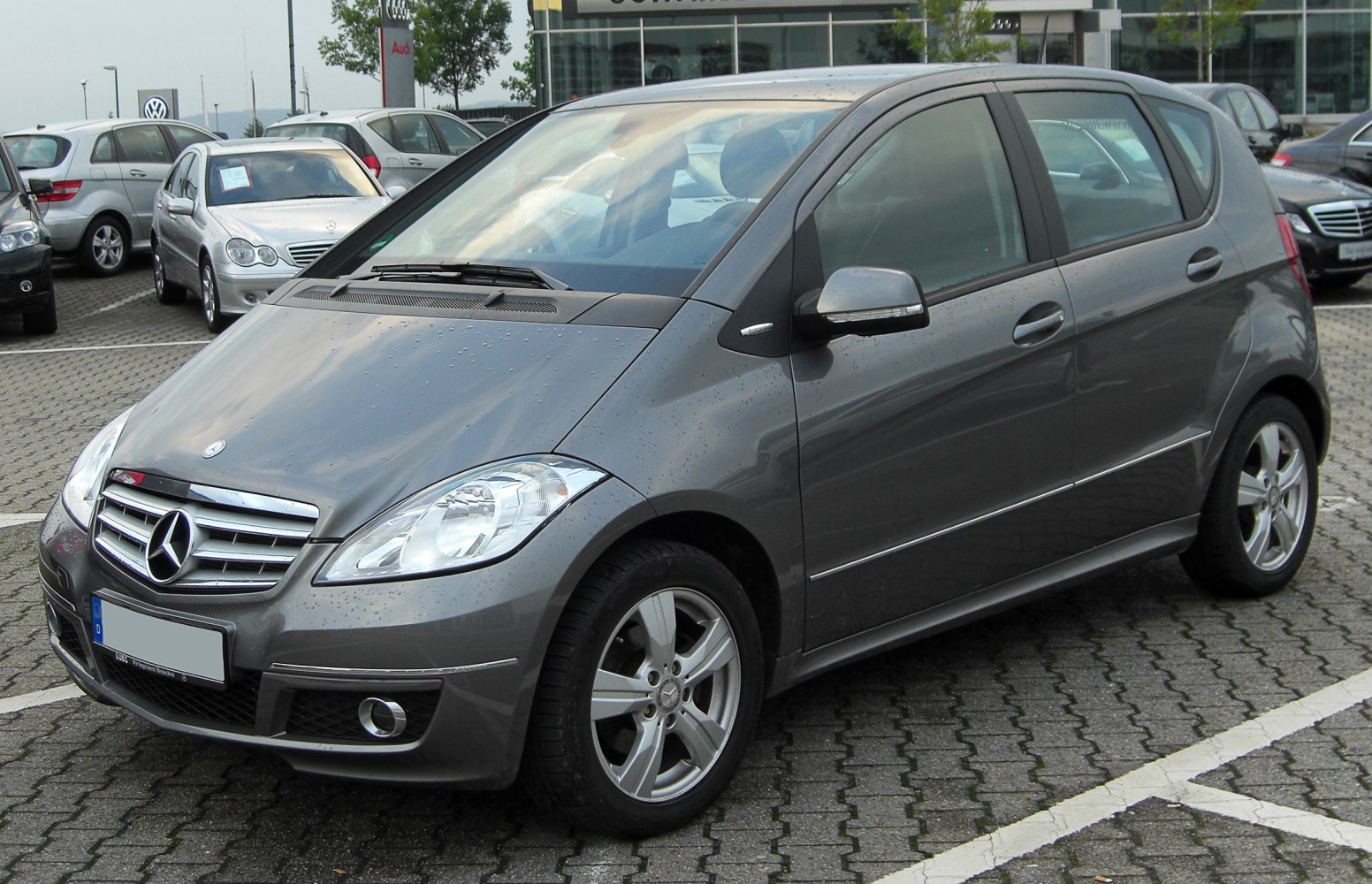 Front and side view of compact hatchback with alloy wheels