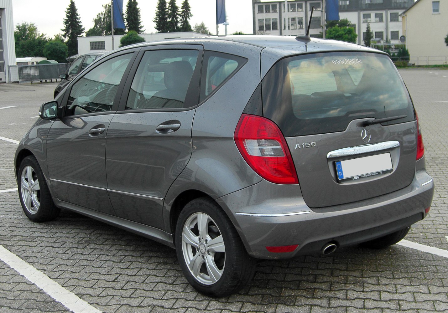 Compact hatchback rear and side with red taillights and alloy wheels
