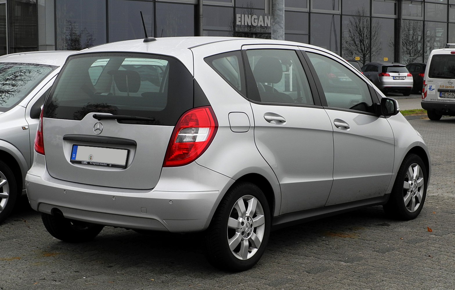 Rear and side view of silver compact five-door hatchback