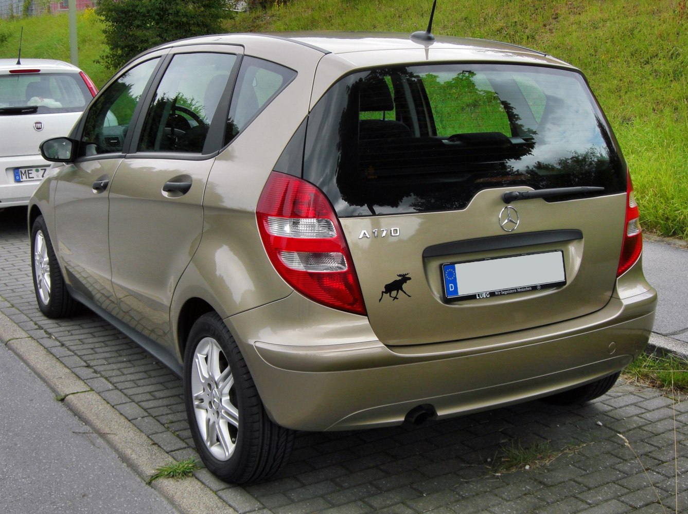 Compact 5-door hatchback rear with distinctive taillights and rear windshield wiper
