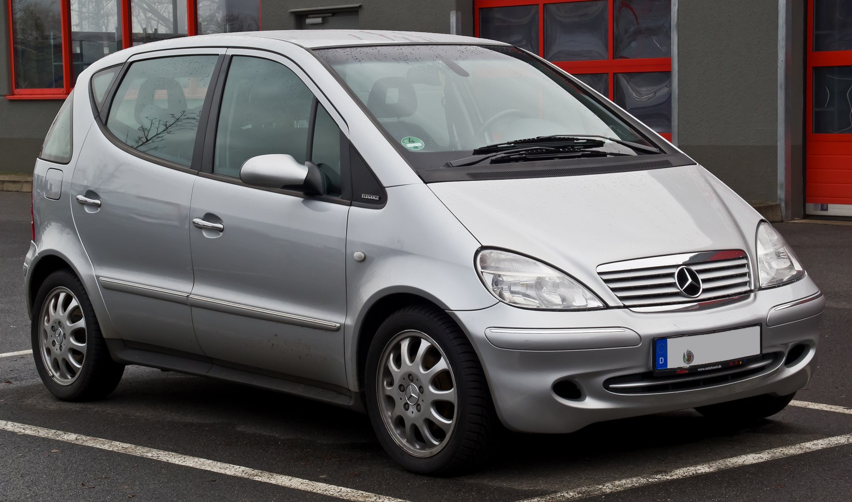 Silver compact hatchback with front side view and alloy wheels