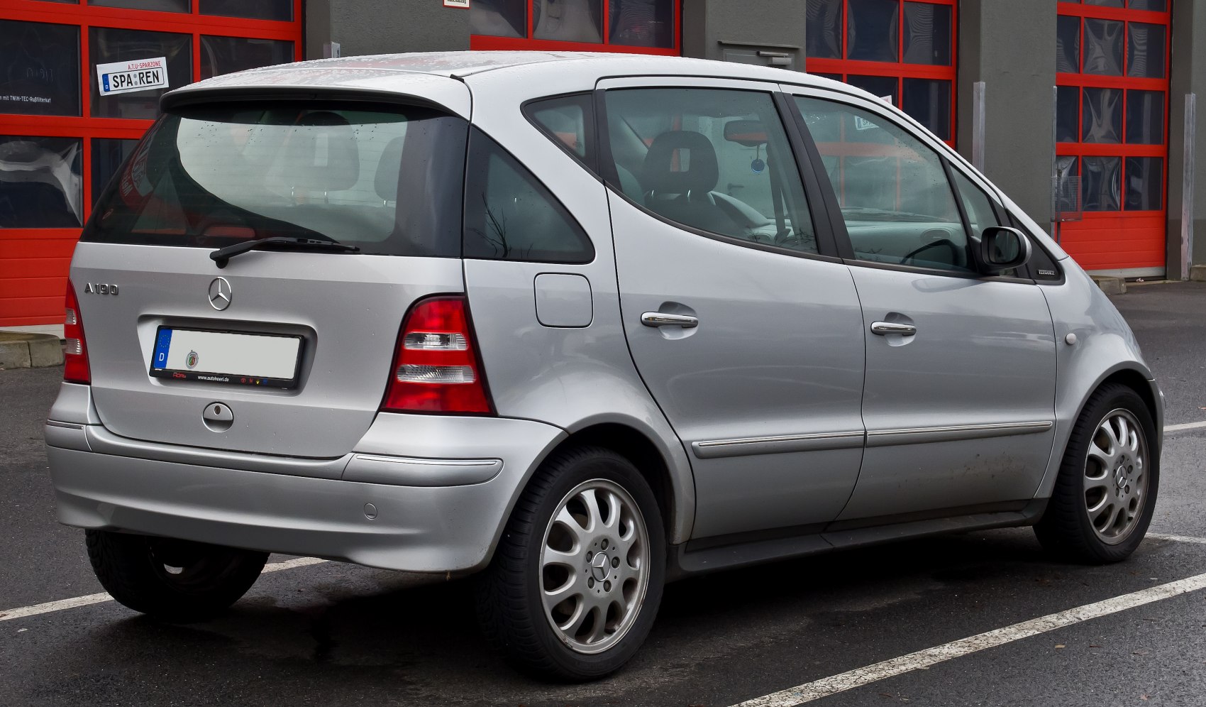 Rear three-quarter view of a silver compact hatchback with alloy wheels and taillights