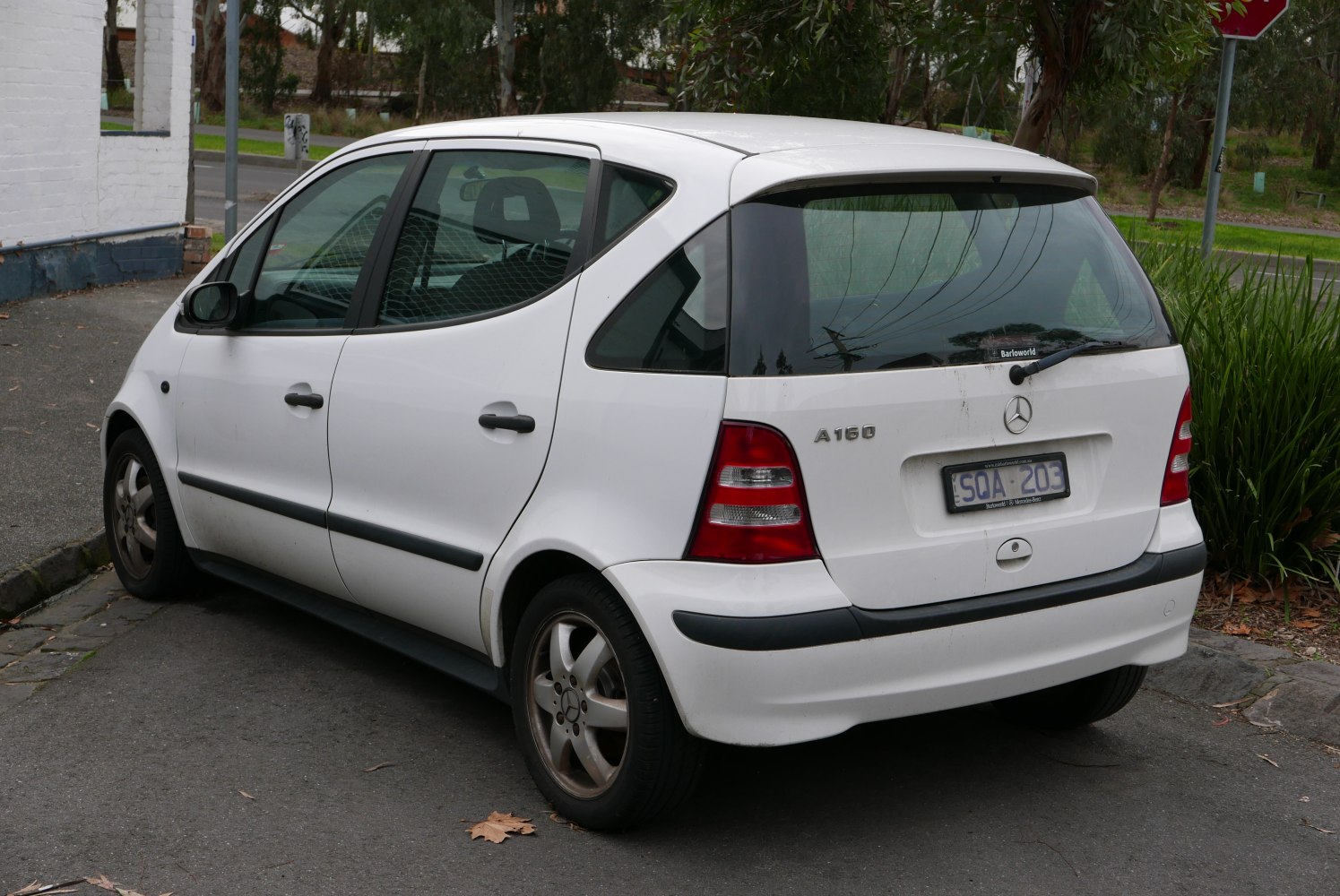 Rear and side view of a compact hatchback with distinctive tail lights.
