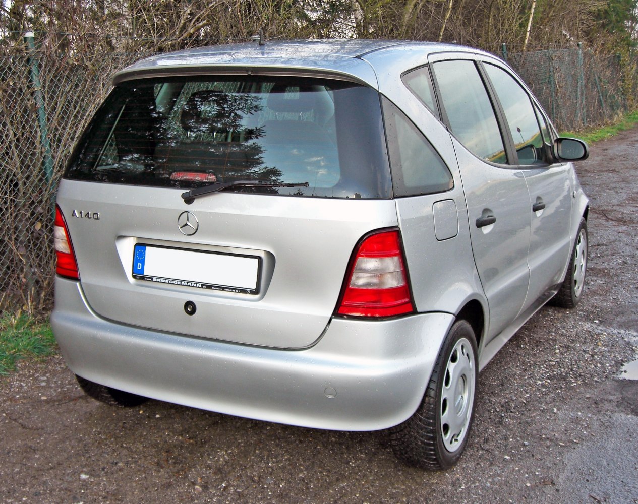 Rear view of silver hatchback with distinct taillights and hatch design