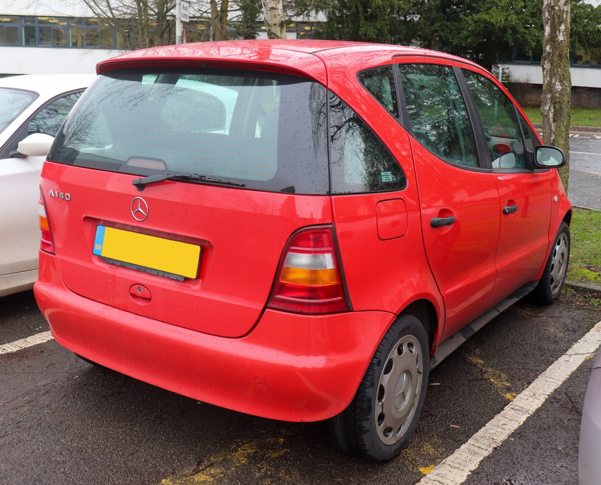 Rear and side view of a compact hatchback with angular design and distinct tail lights