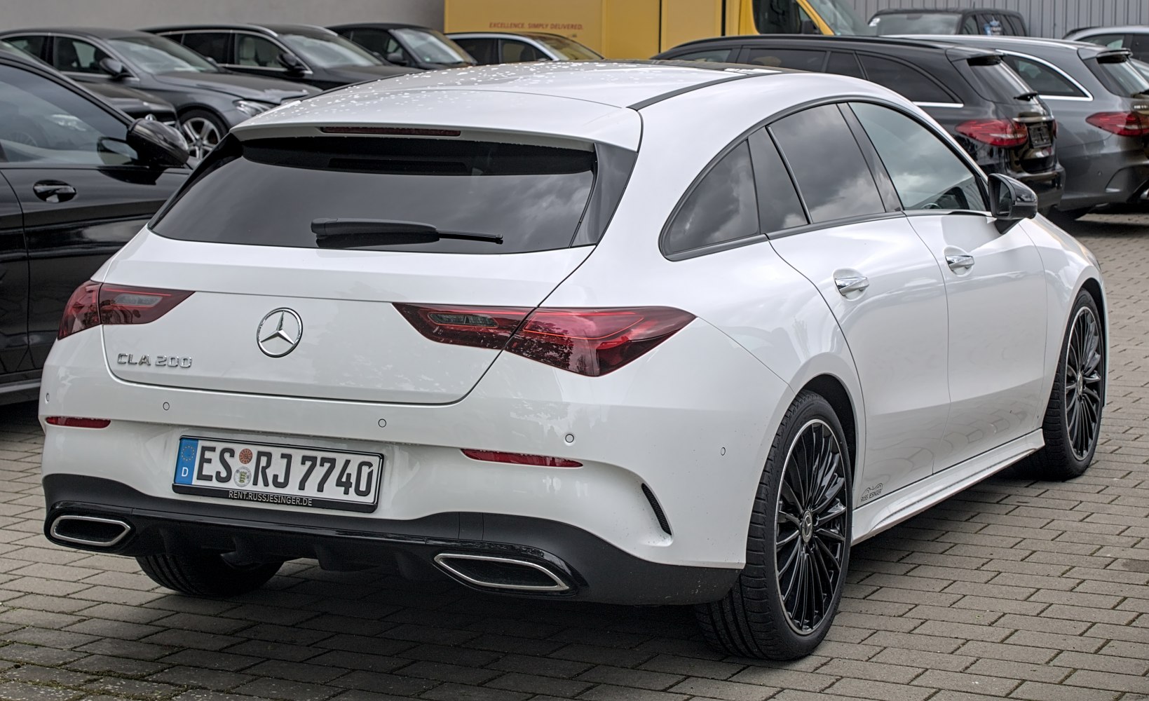 Sleek rear design with dual exhausts and sporty wheels