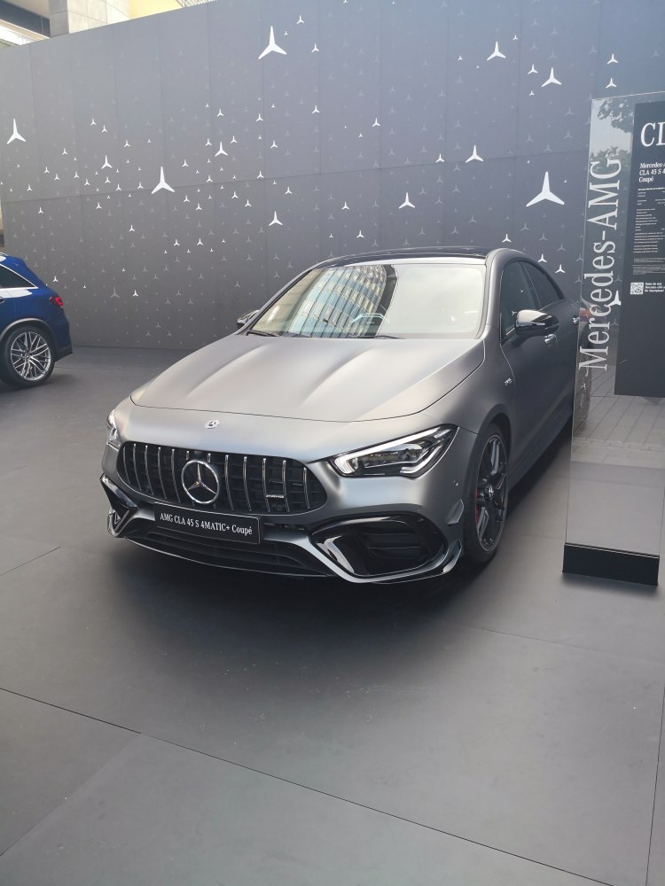 Front view of luxury coupe with AMG grille and LED headlights