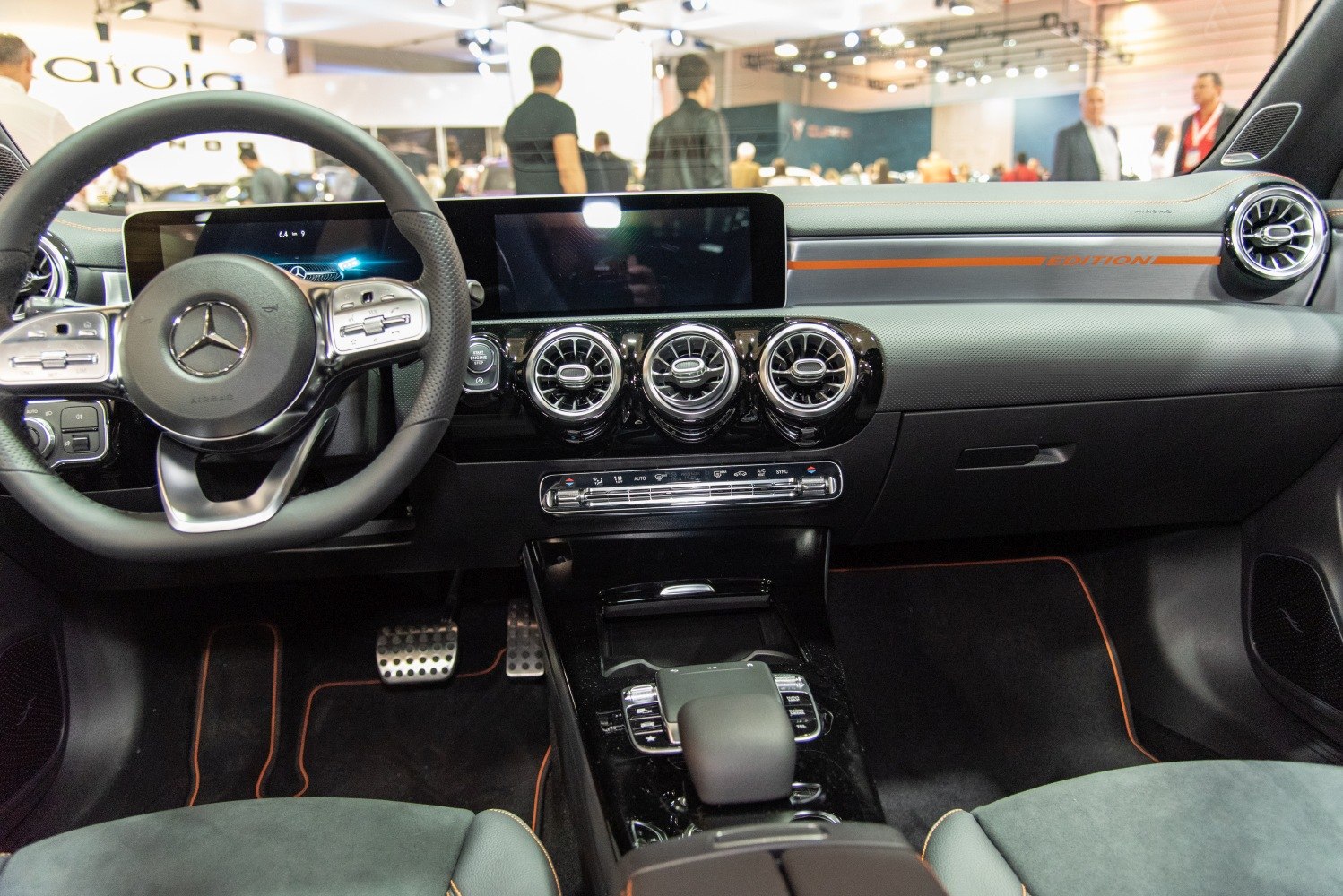 Digital dashboard and round air vents with multifunction steering wheel