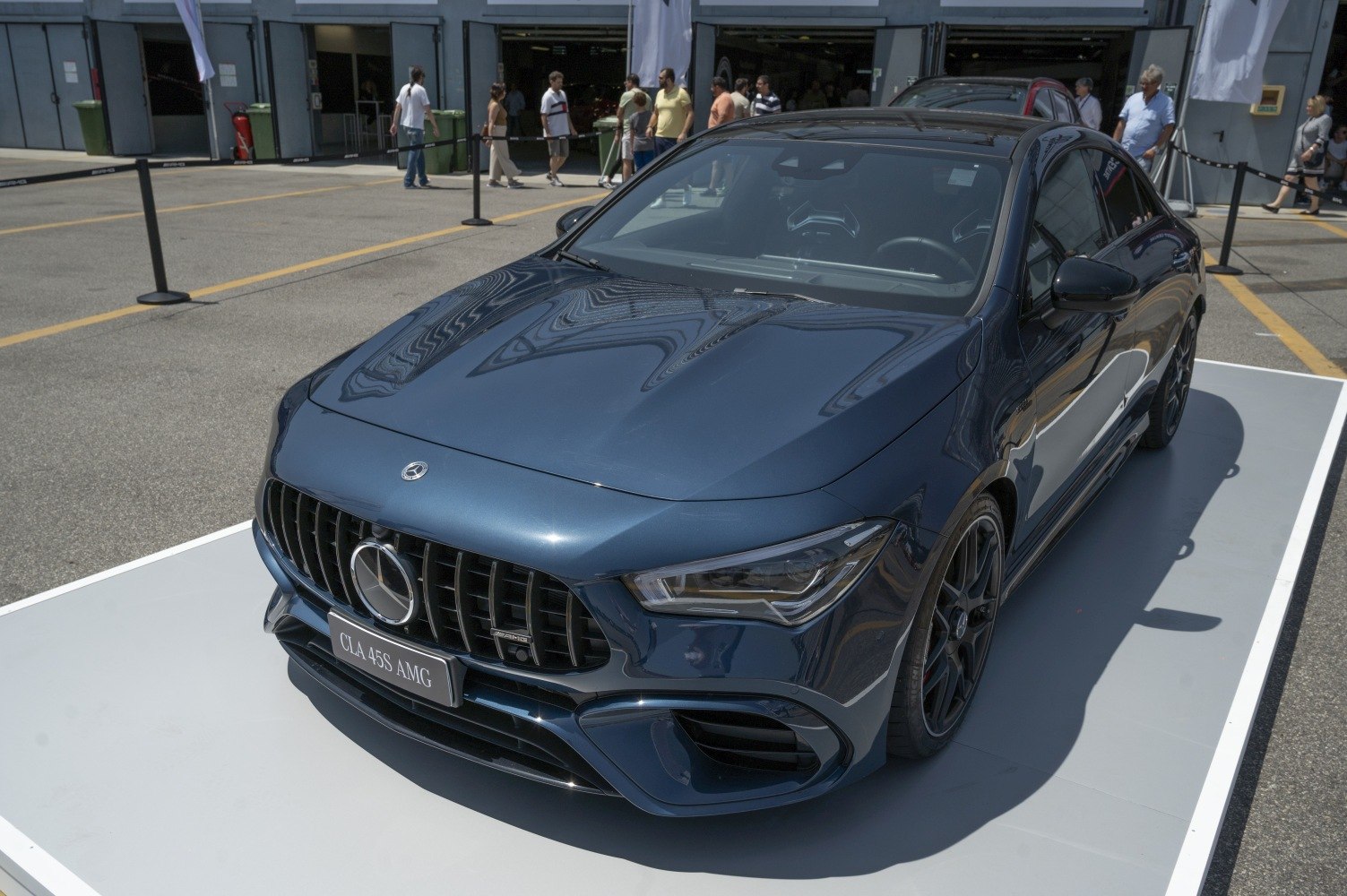 Front view of luxury sedan with aggressive grille and sharp LED headlights