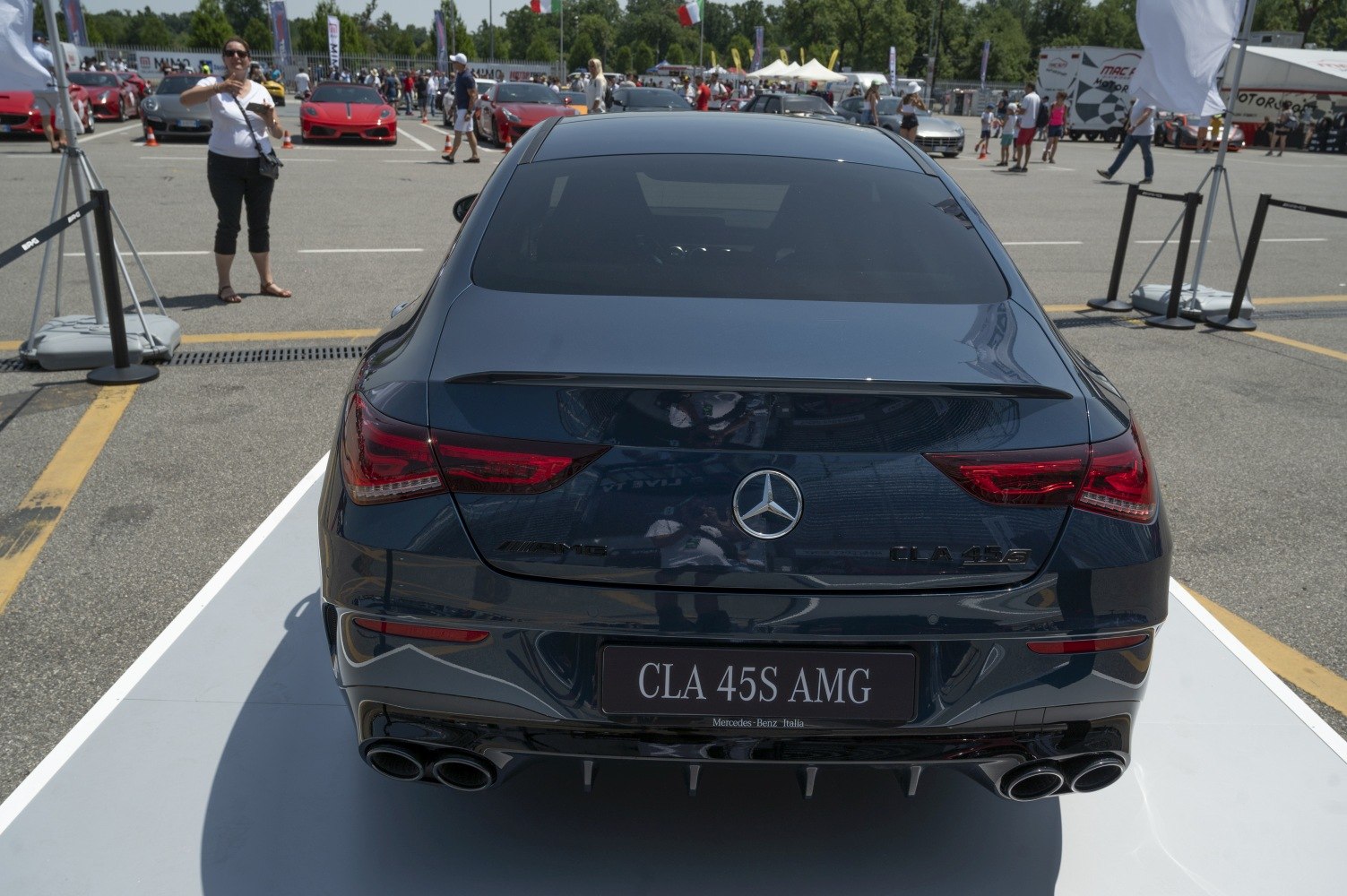 Sporty coupe rear view with quad exhausts and sleek taillights