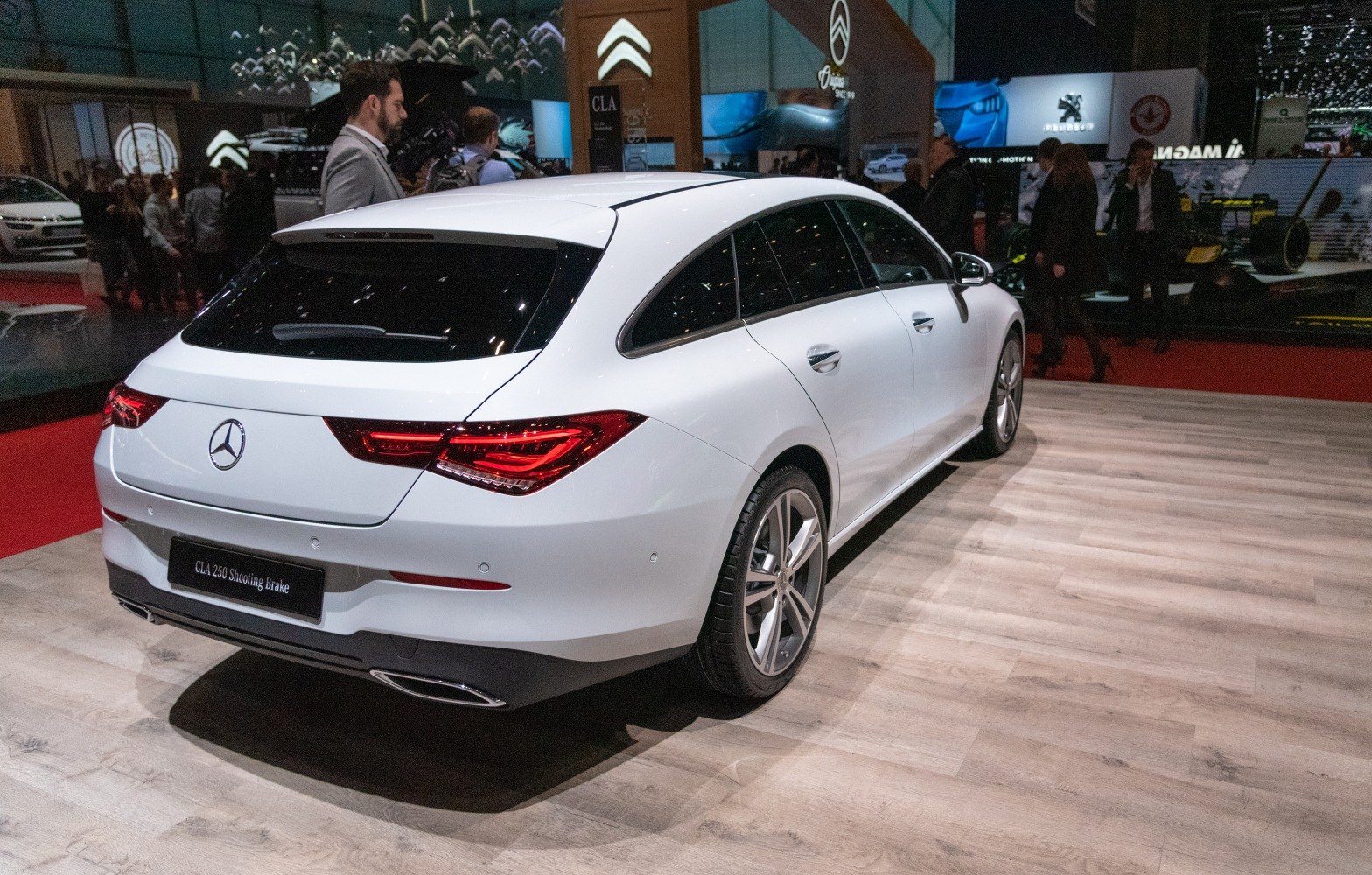 Rear view of a white station wagon with distinctive tail lights and sleek design