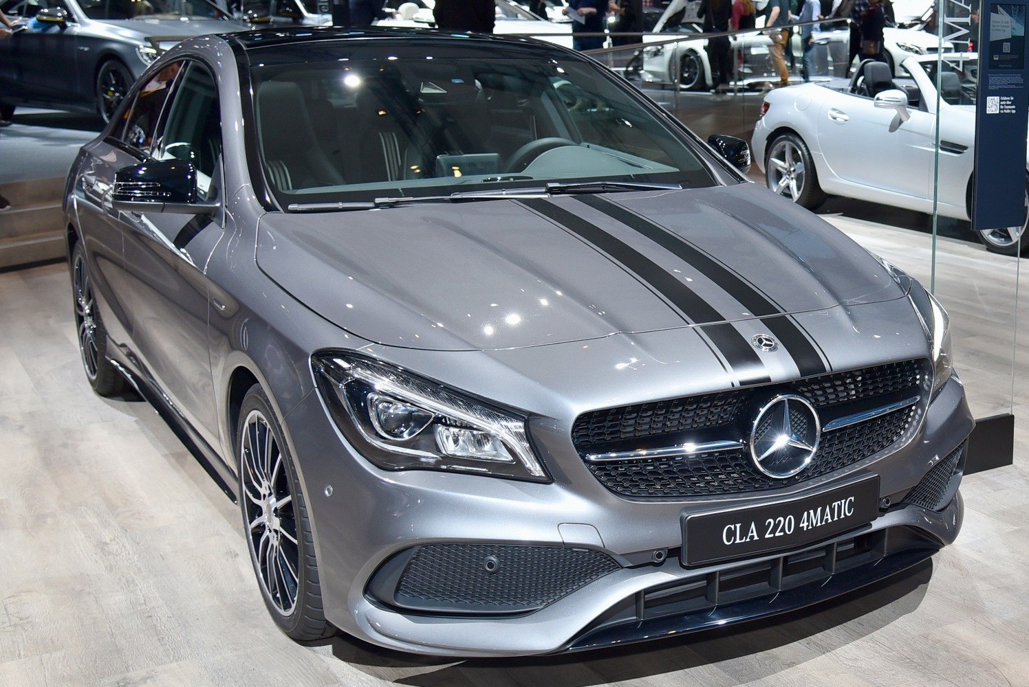 Front view with grille, headlights, and sporty hood stripes