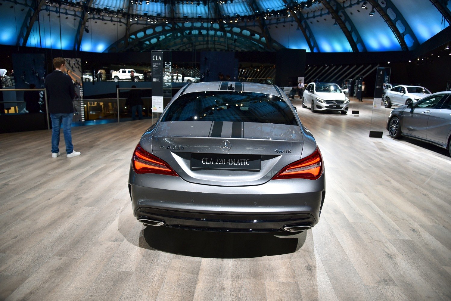 Rear design of facelifted coupe with sharp tail lights and dual exhausts