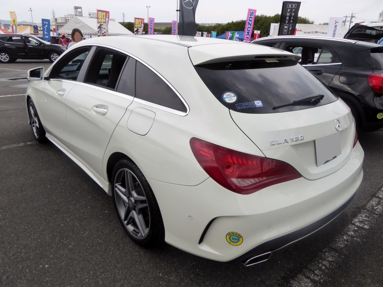 White compact shooting brake with sporty rear design and alloy wheels