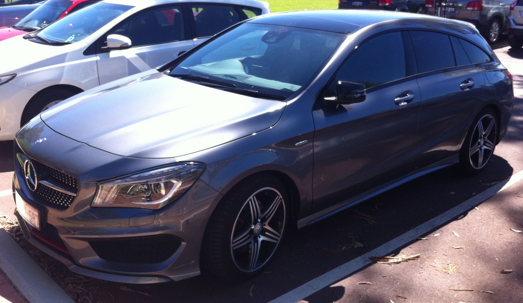 Gray compact luxury wagon with sporty front grille and alloy wheels