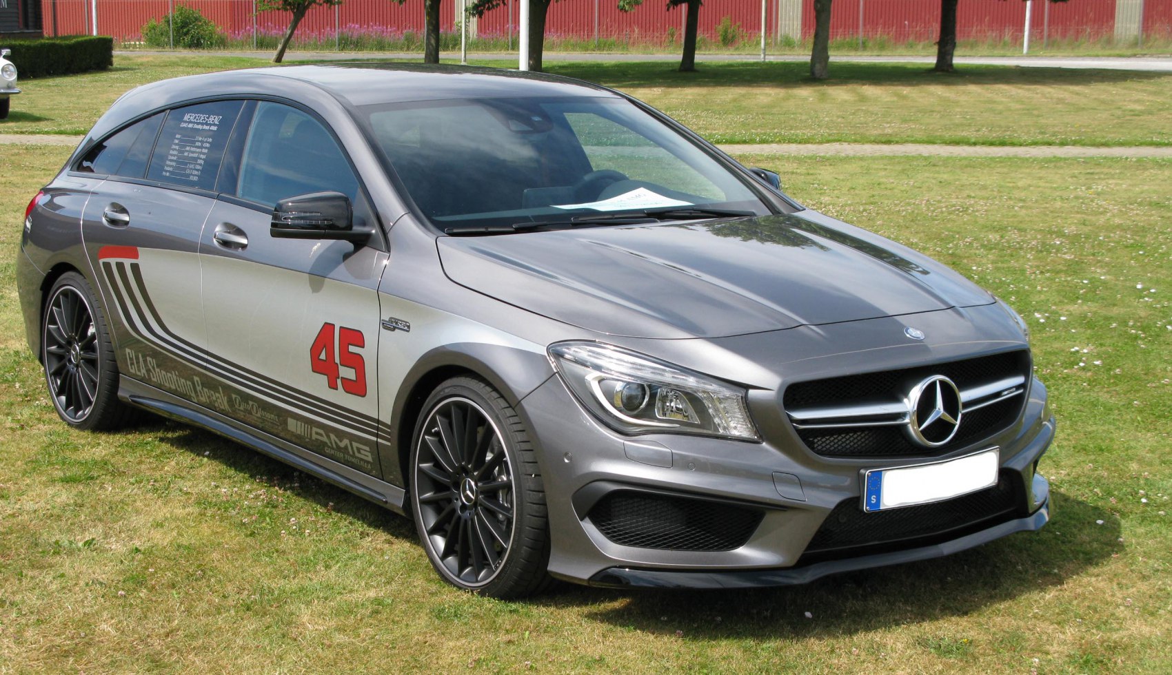 Front-side view of sporty wagon with AMG styling and decals.