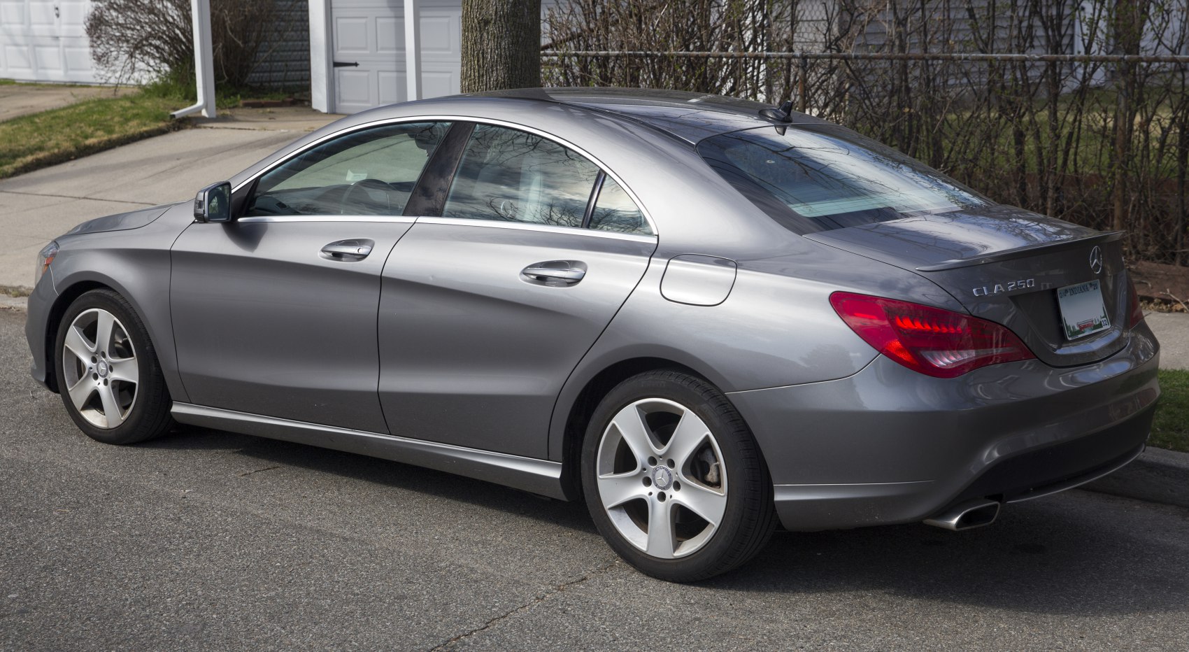 Rear quarter view with sleek wheel design and aerodynamic side profile