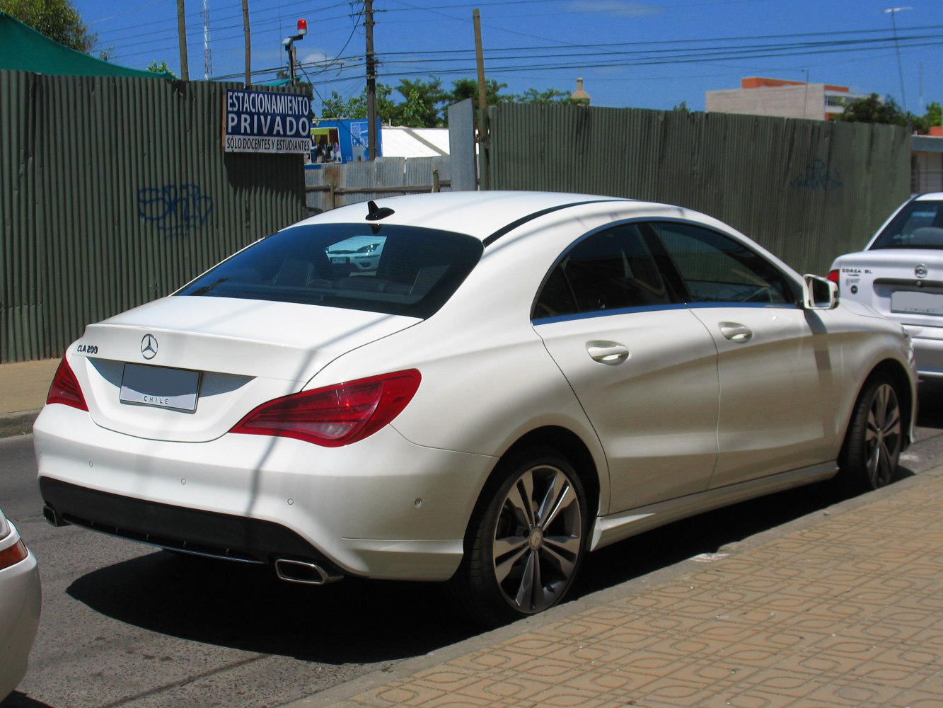Rear and side view of luxury sedan with distinctive taillights and sleek body lines