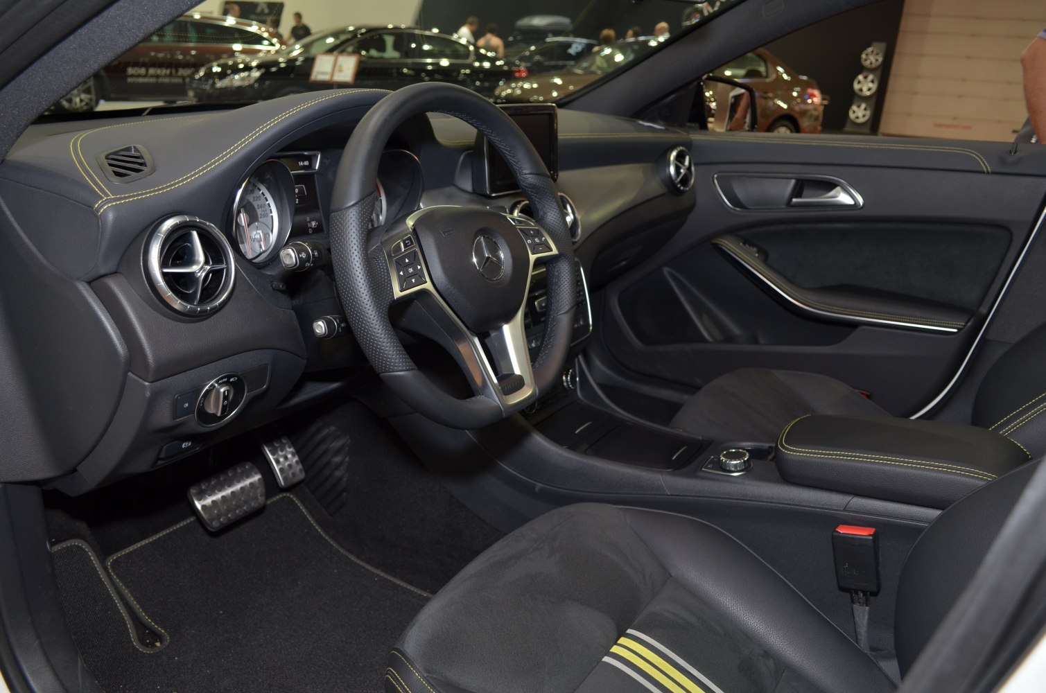 Leather steering wheel and sport seats with detailed dashboard and upholstery stitching