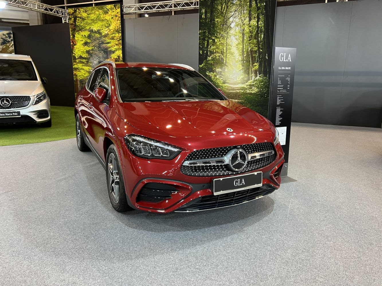Front grille and LED headlights of a luxury red SUV