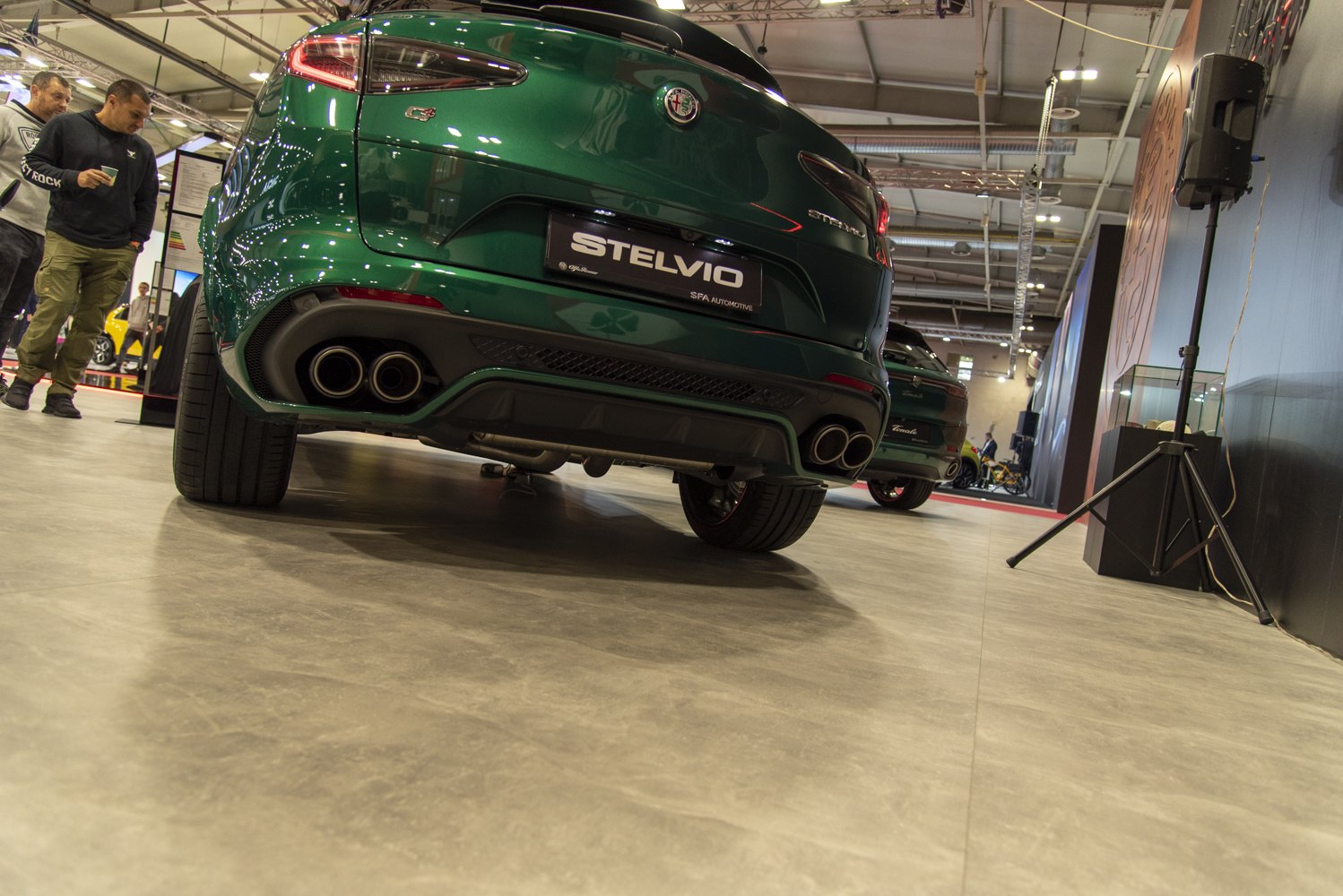 Rear view with quad exhaust tips and sporty hatch design