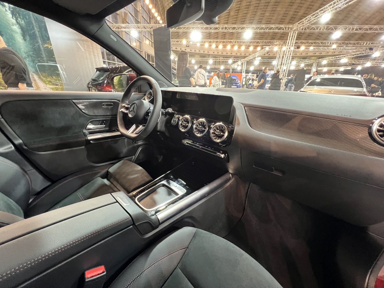 Sleek black interior with digital display and circular air vents