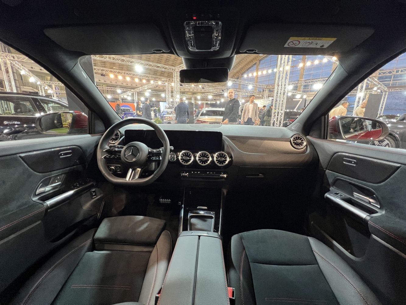 Dashboard view with round air vents and multifunction steering wheel