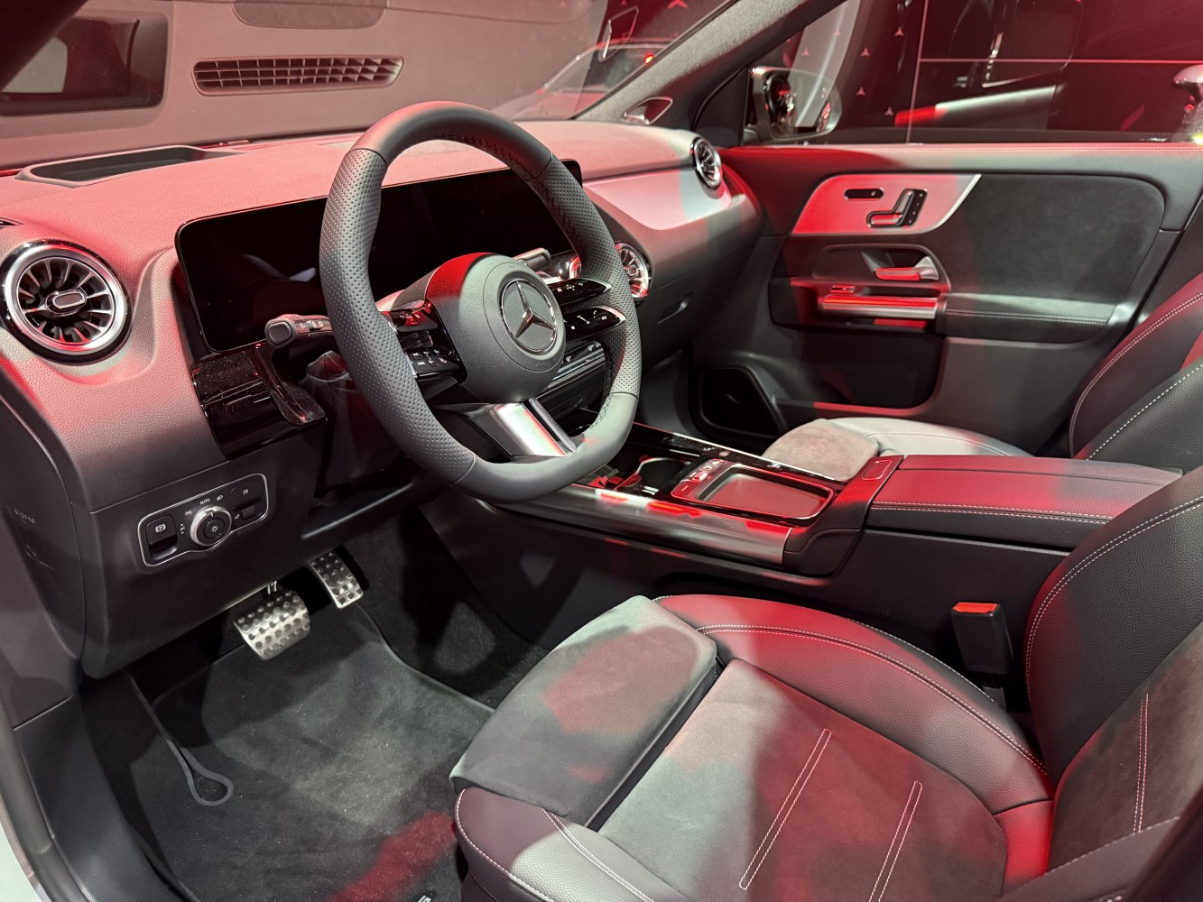 Modern dashboard and steering wheel with advanced controls and air vents
