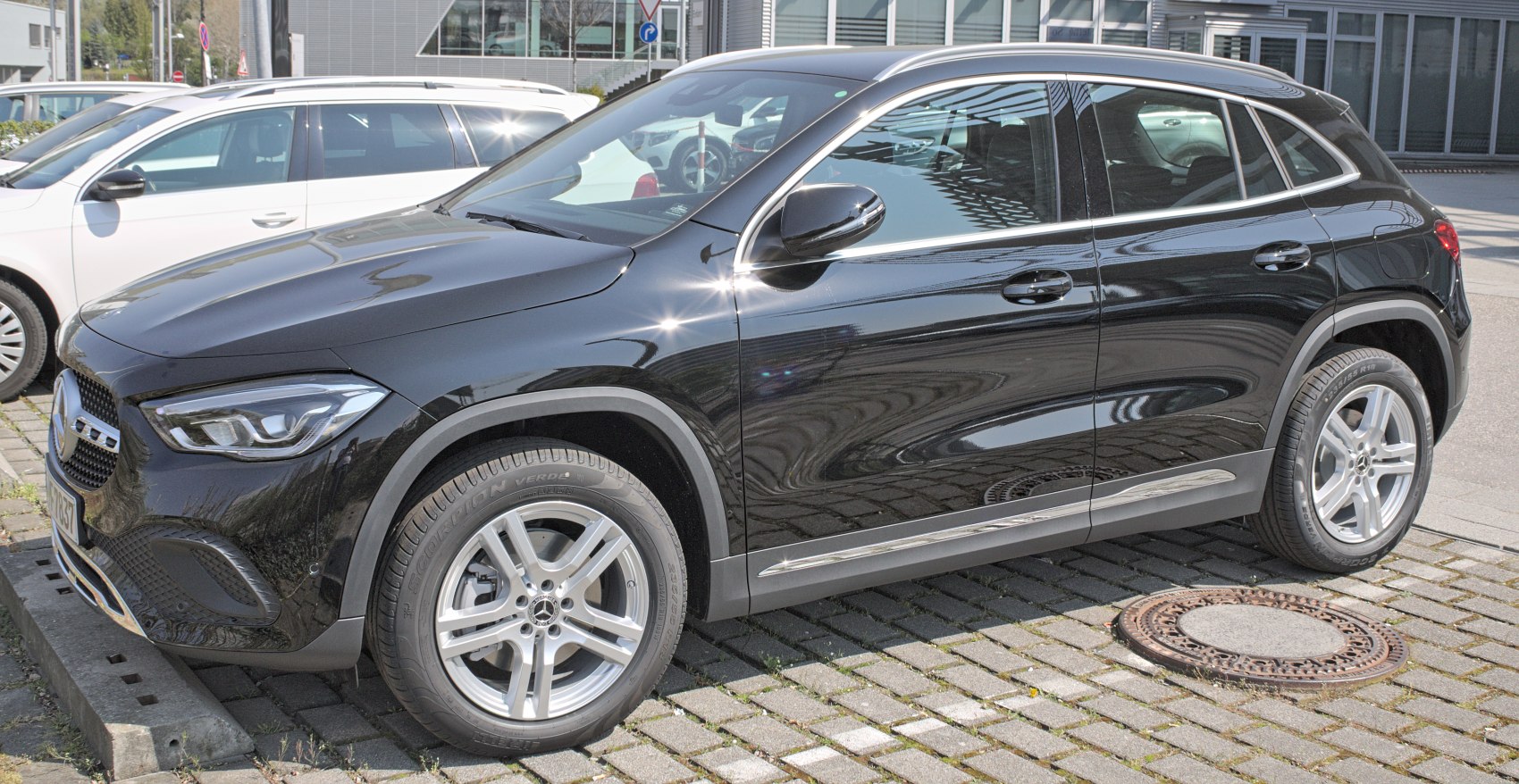 Side profile with front end and alloy wheels of a sleek black SUV