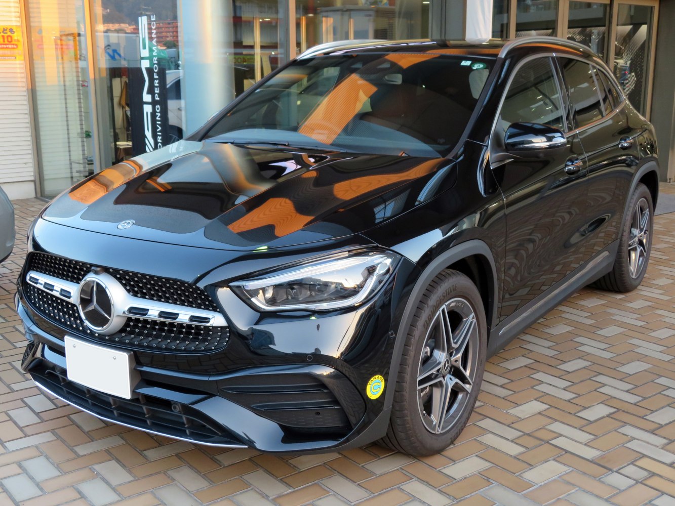 Front view with LED headlights, star grille, and alloy wheels