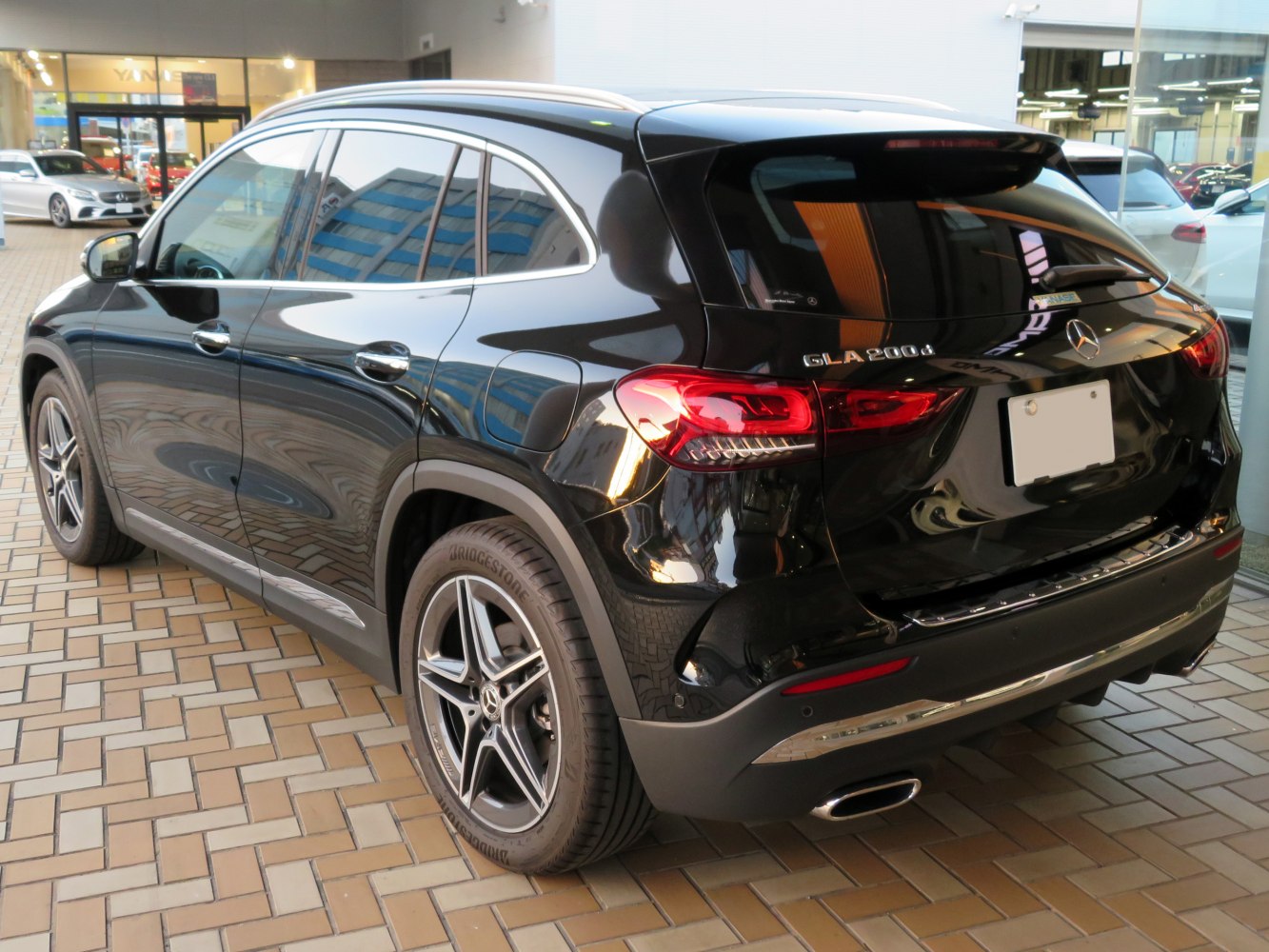 Rear side view of a modern SUV with LED taillights and alloy wheels.