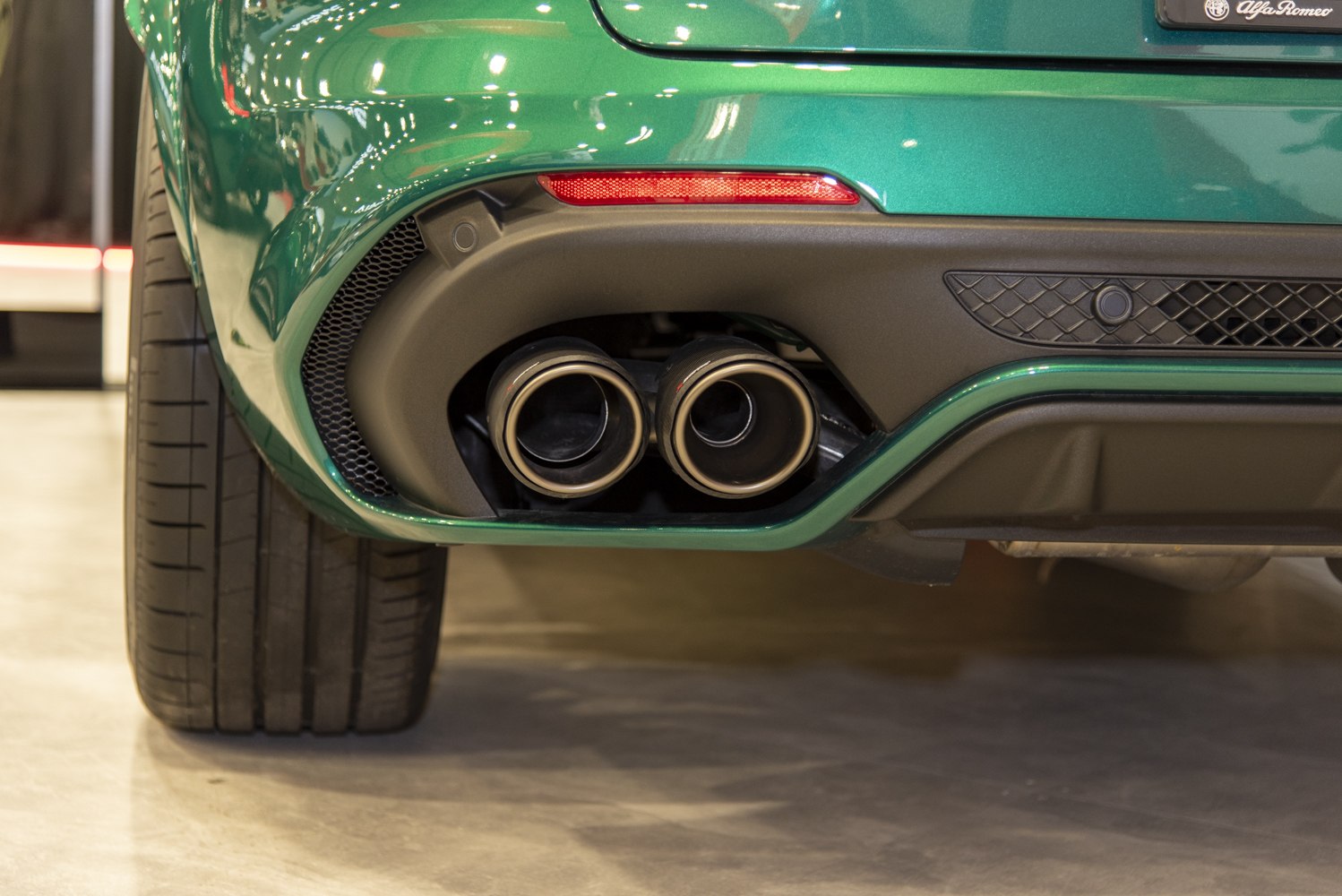 Close-up of rear dual exhaust pipes and bumper detail