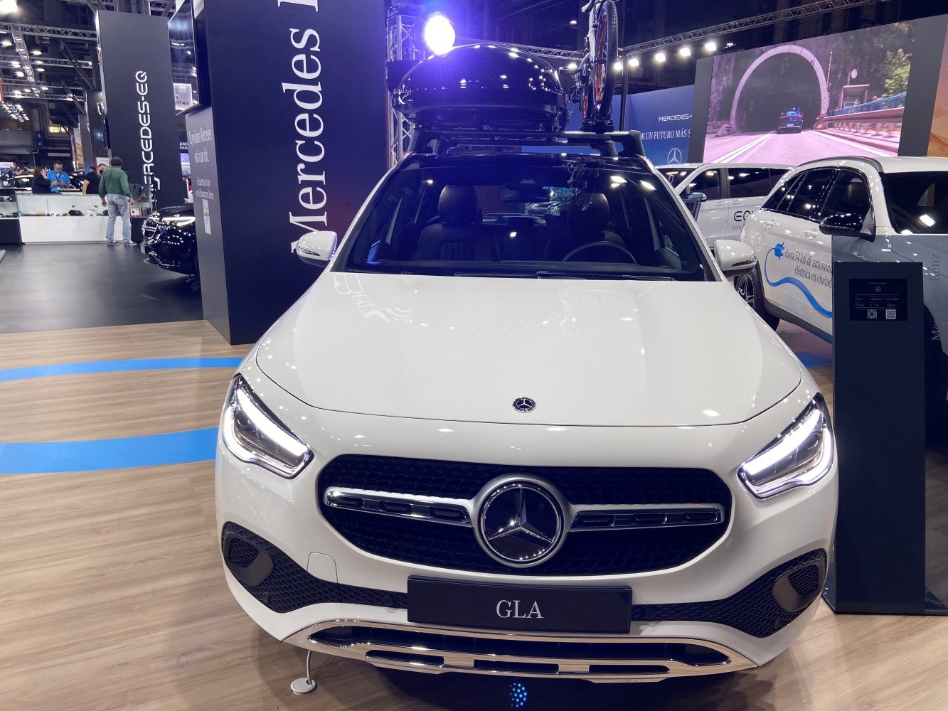 Front view with LED headlights and roof cargo carrier
