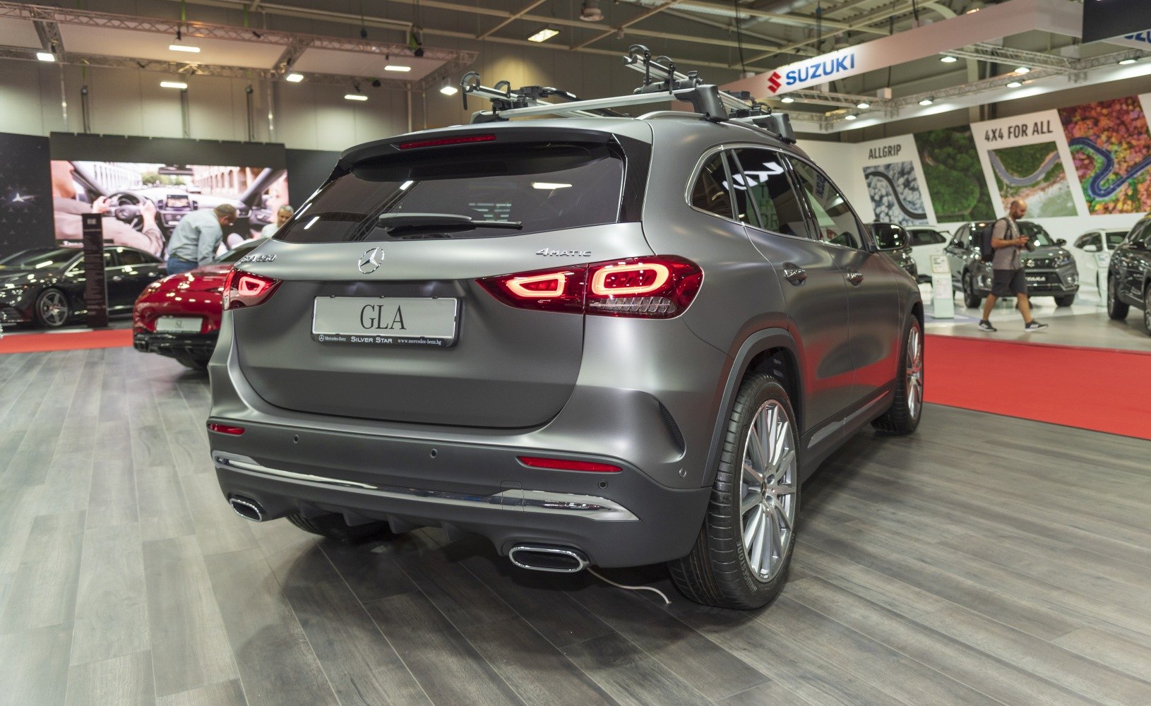 Rear view of SUV with distinctive tail lights and roof rack