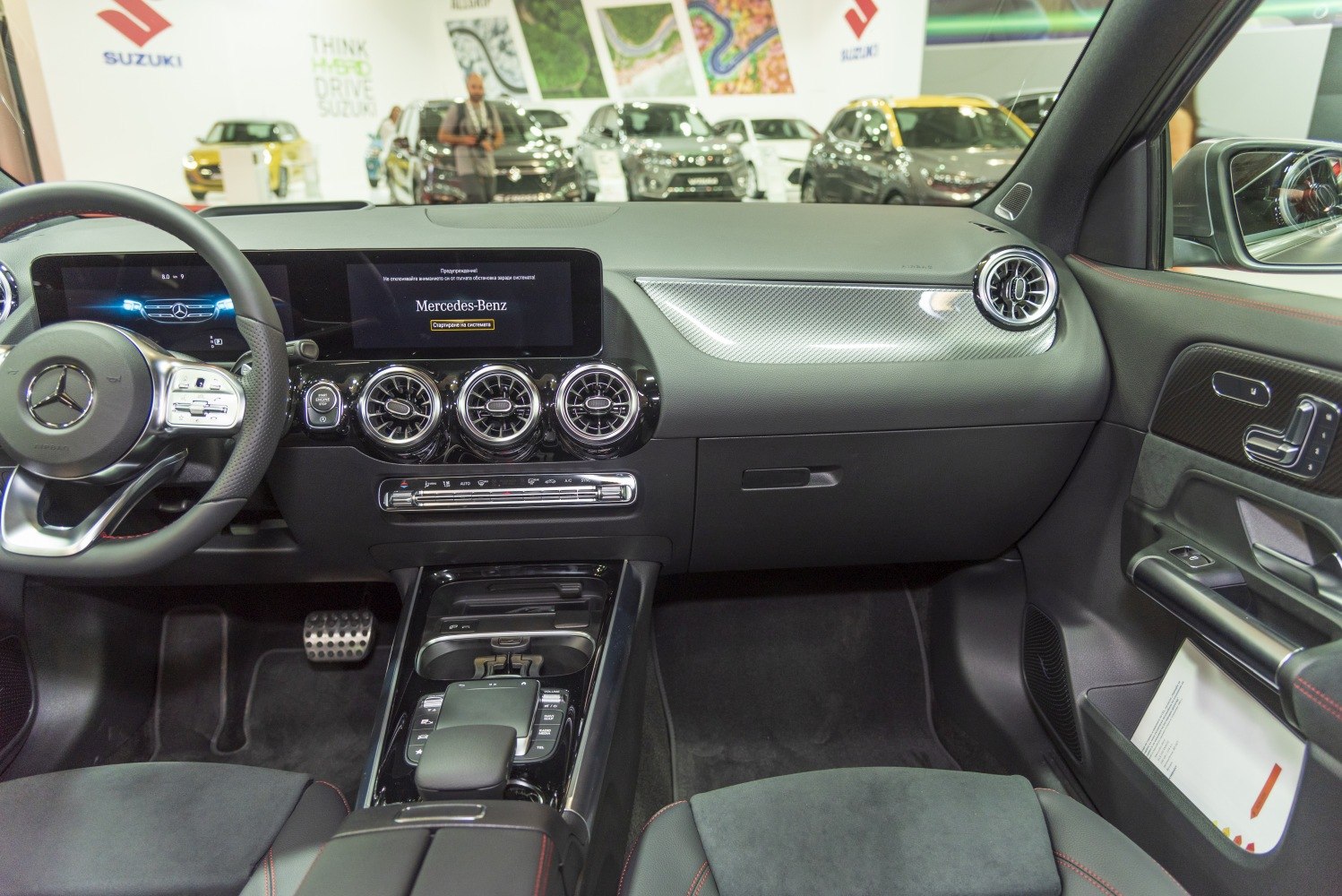 Interior dashboard with digital display, steering wheel, and air vents