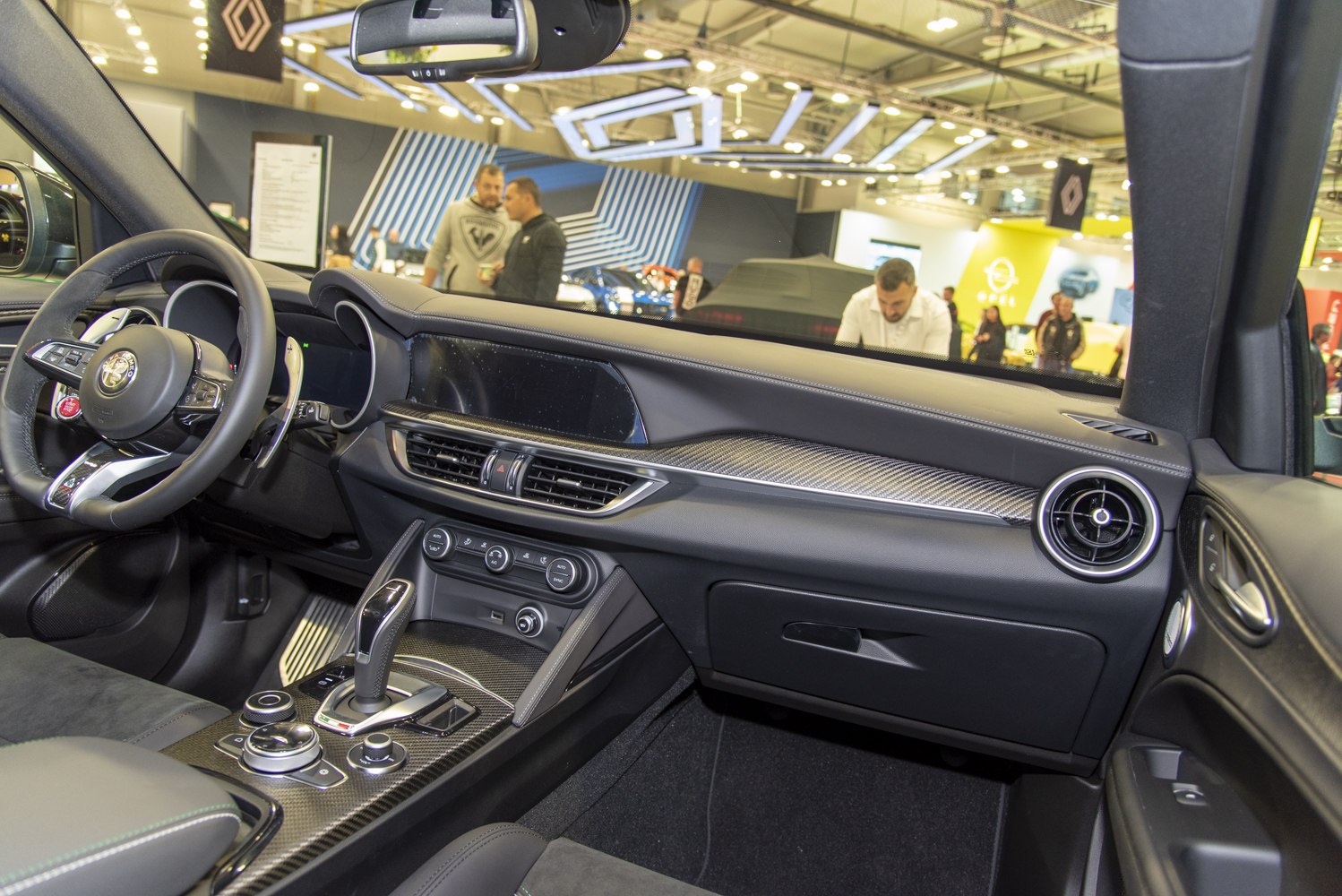 Luxury SUV interior with carbon fiber trim and advanced controls