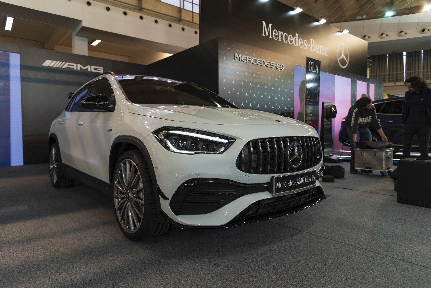 Close-up of front grille and LED headlights with AMG styling.