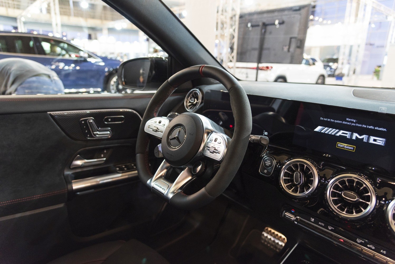 AMG steering wheel and dual circular air vents with digital display